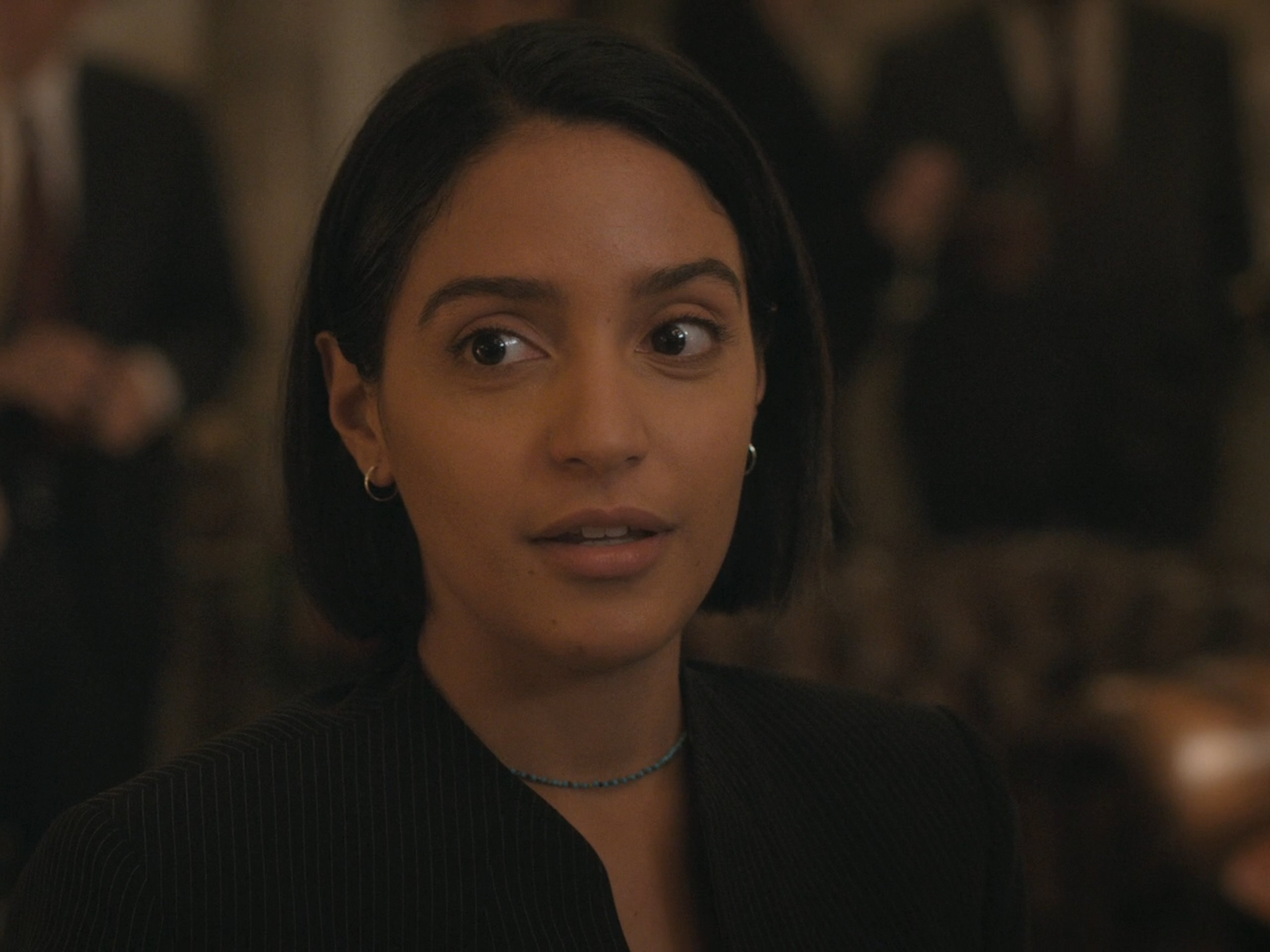 A woman with dark hair wearing a black jacket