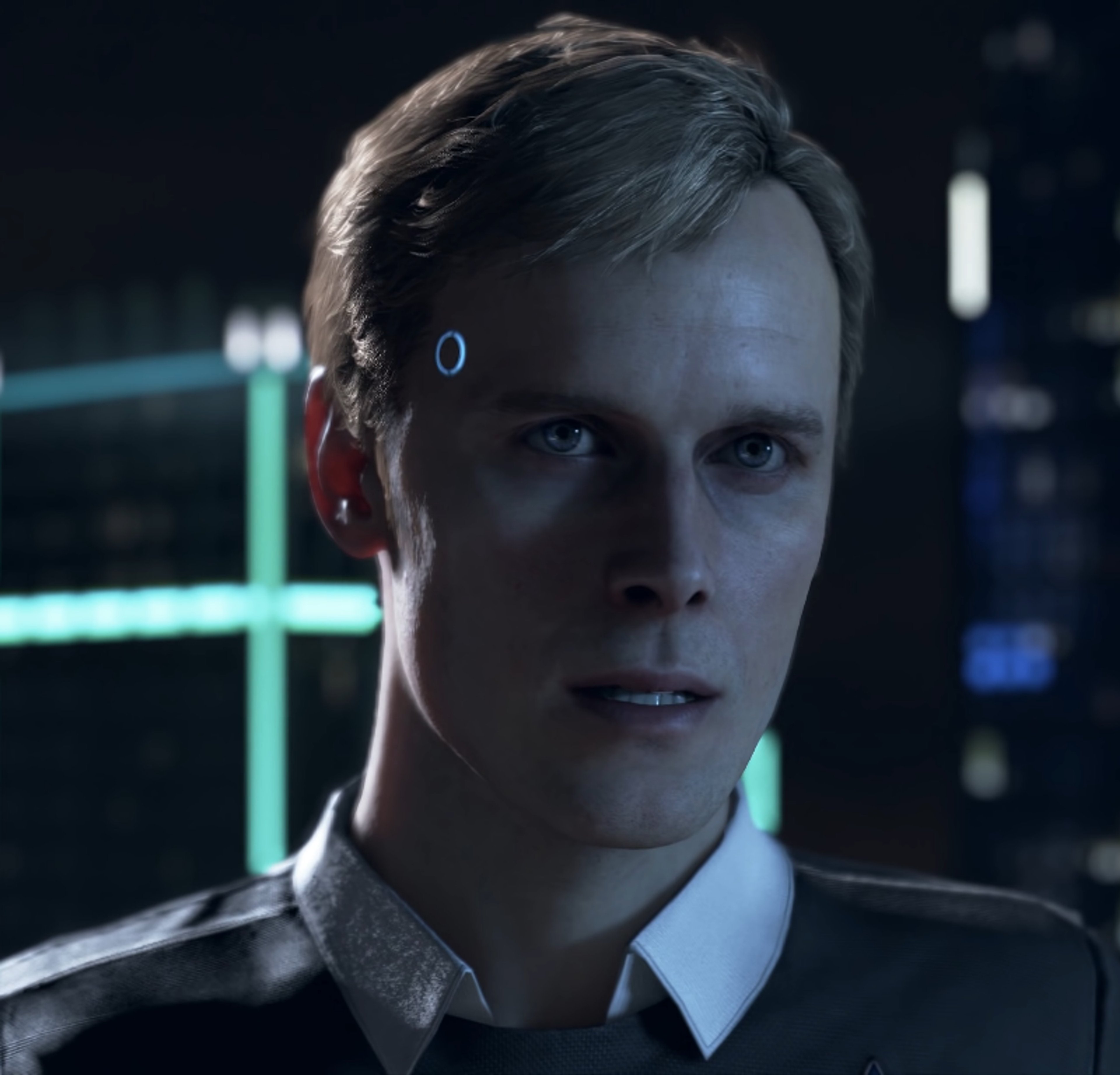 A close-up portrait of a male android character with blond hair and blue eyes, wearing a white shirt and dark jacket.