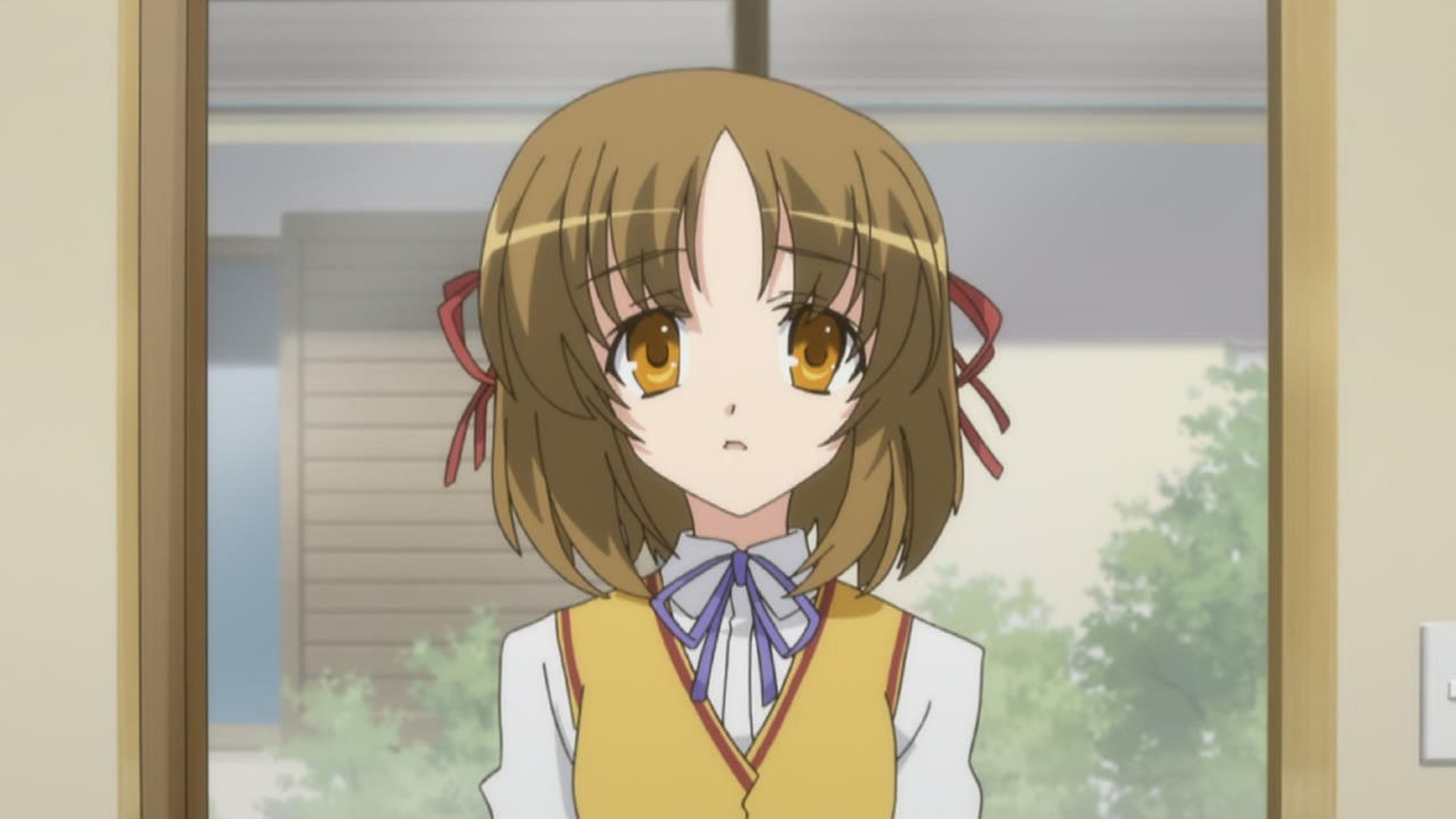An anime-style character with short brown hair wearing a yellow sweater vest and blue bow tie