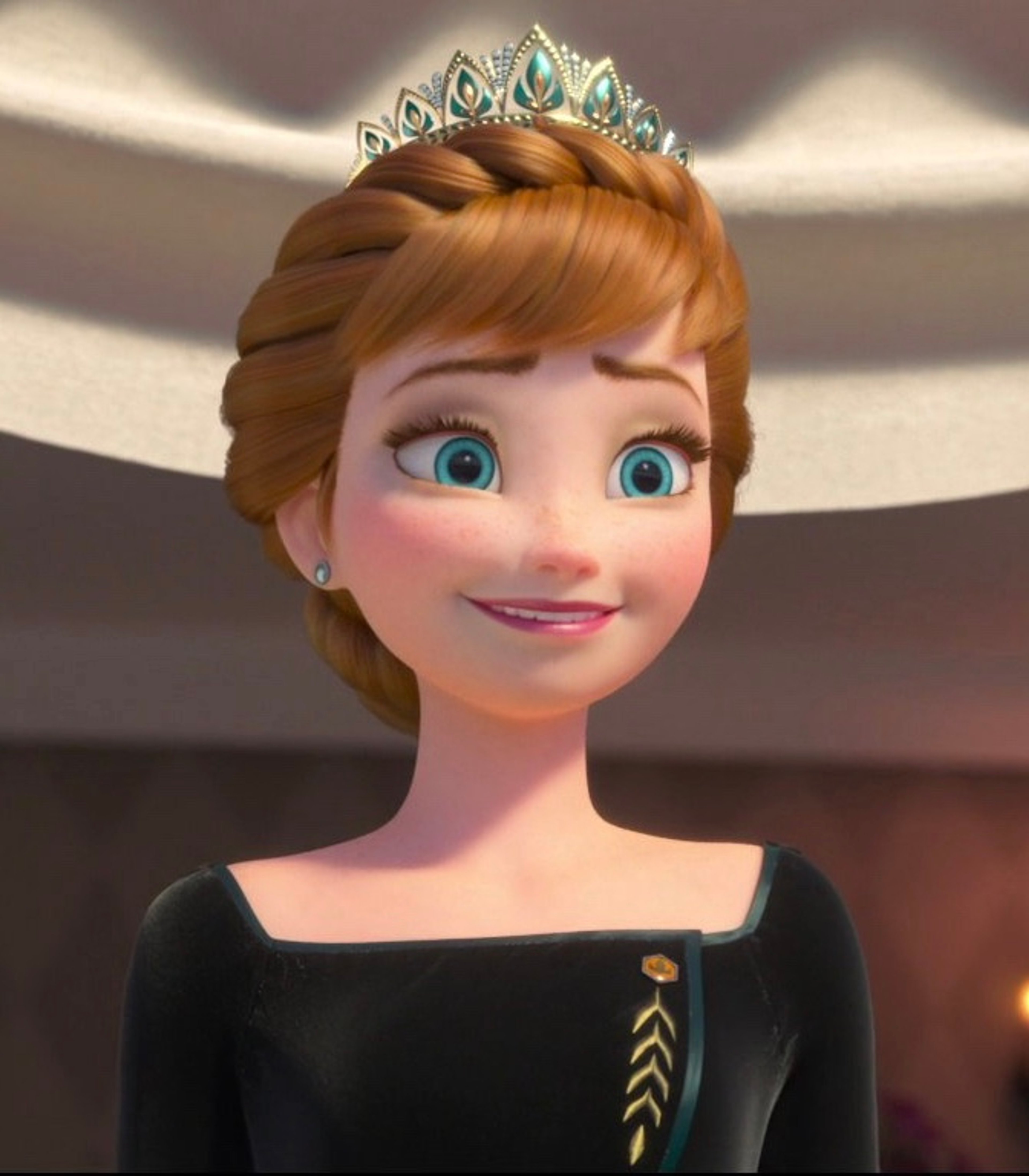 A young woman with reddish-brown hair wearing a black dress and crown-like tiara