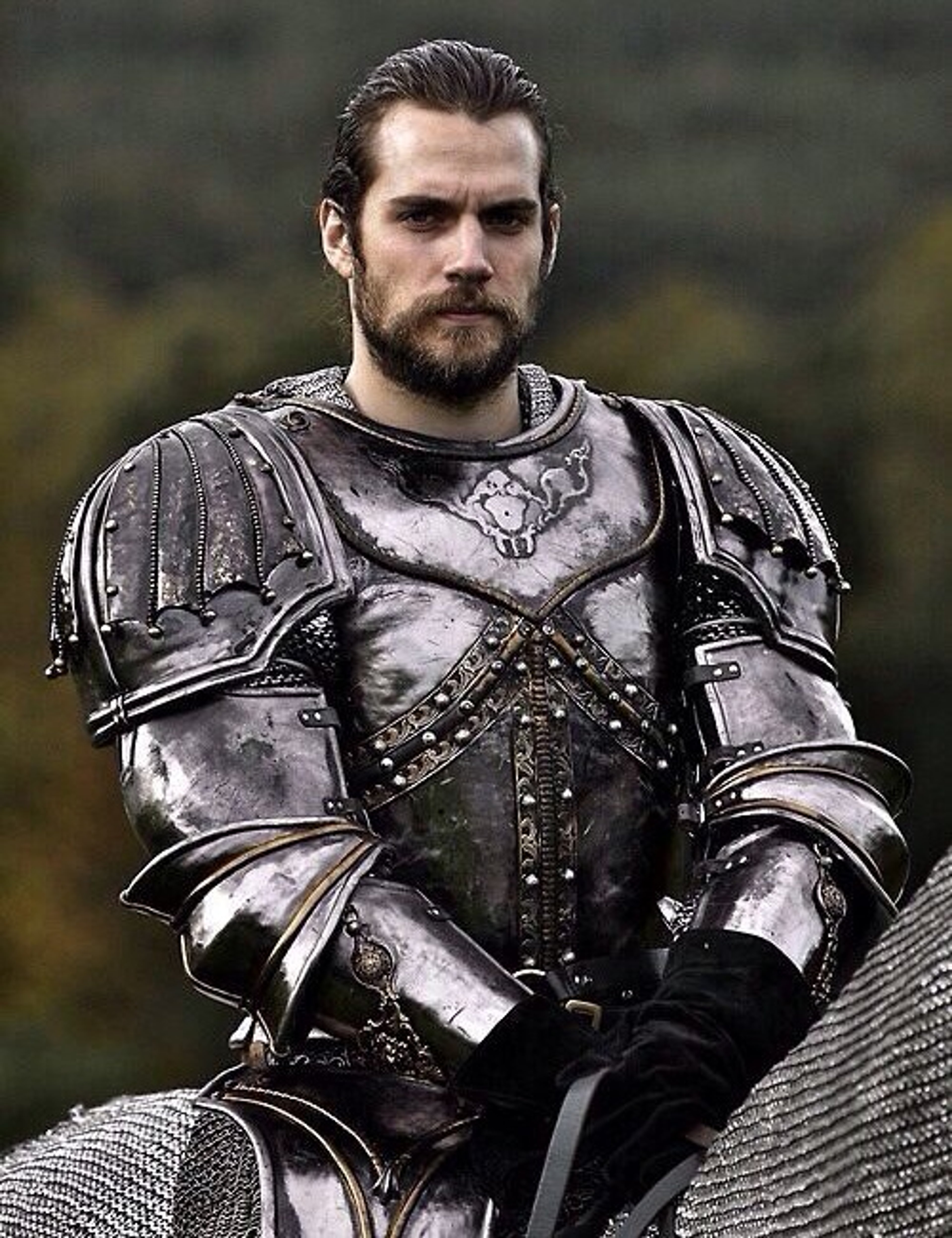 A powerful, armored warrior with a stern expression