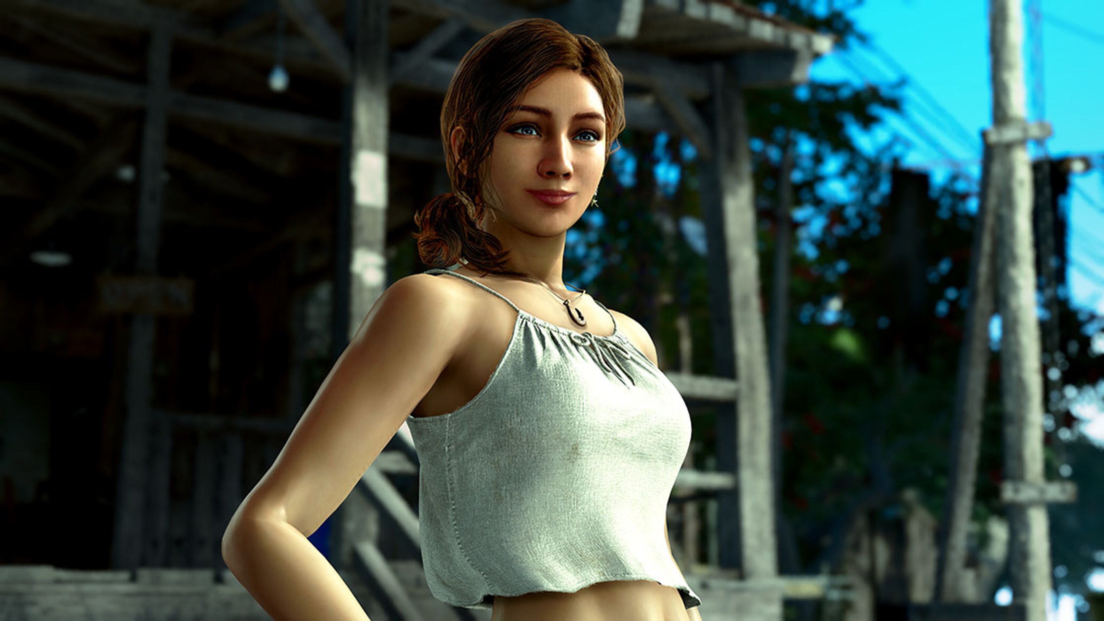 A young woman with long dark hair wearing a white crop top, standing in a tropical outdoor setting.