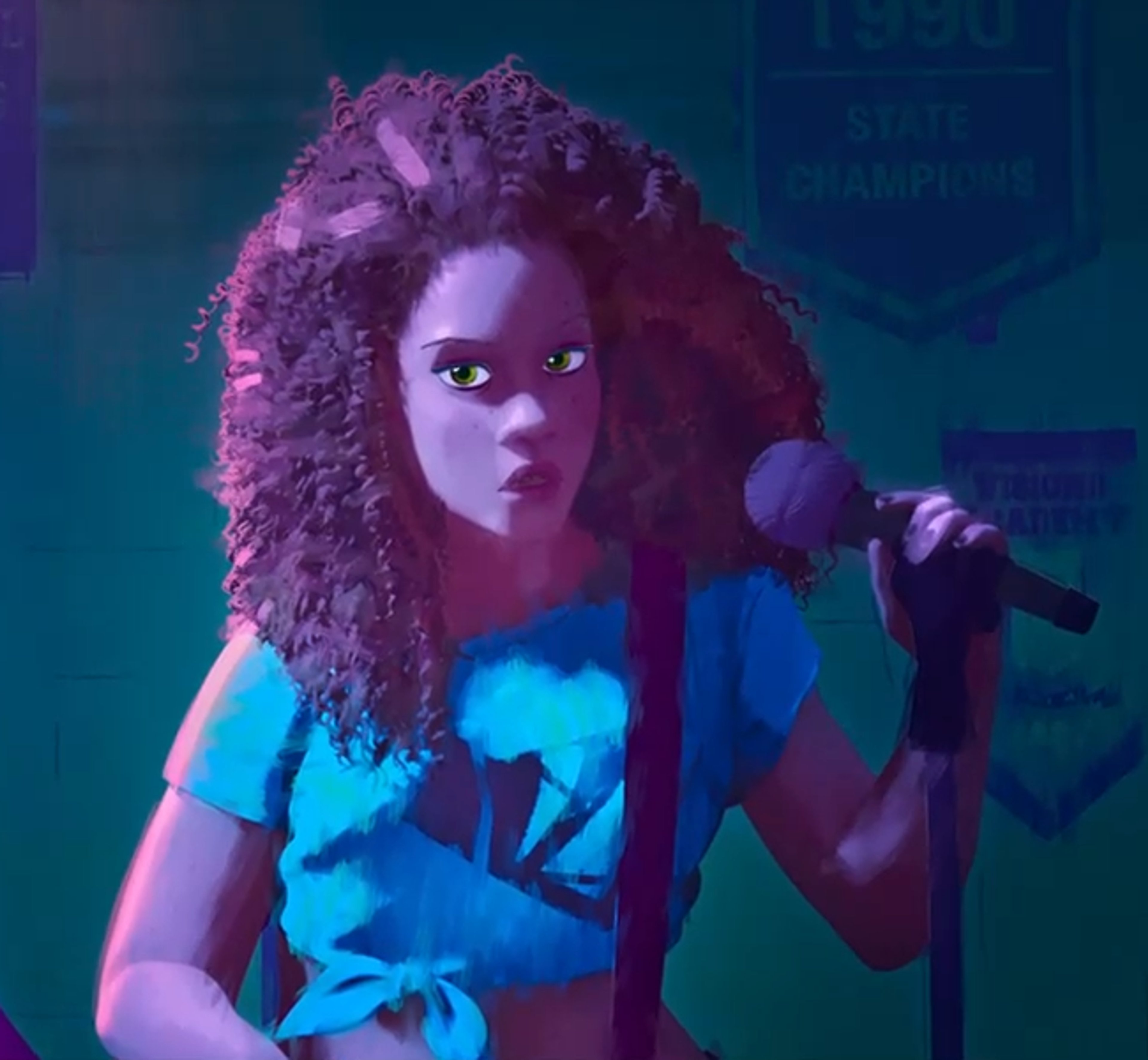 A young woman with curly red hair performing on stage in a blue and white outfit