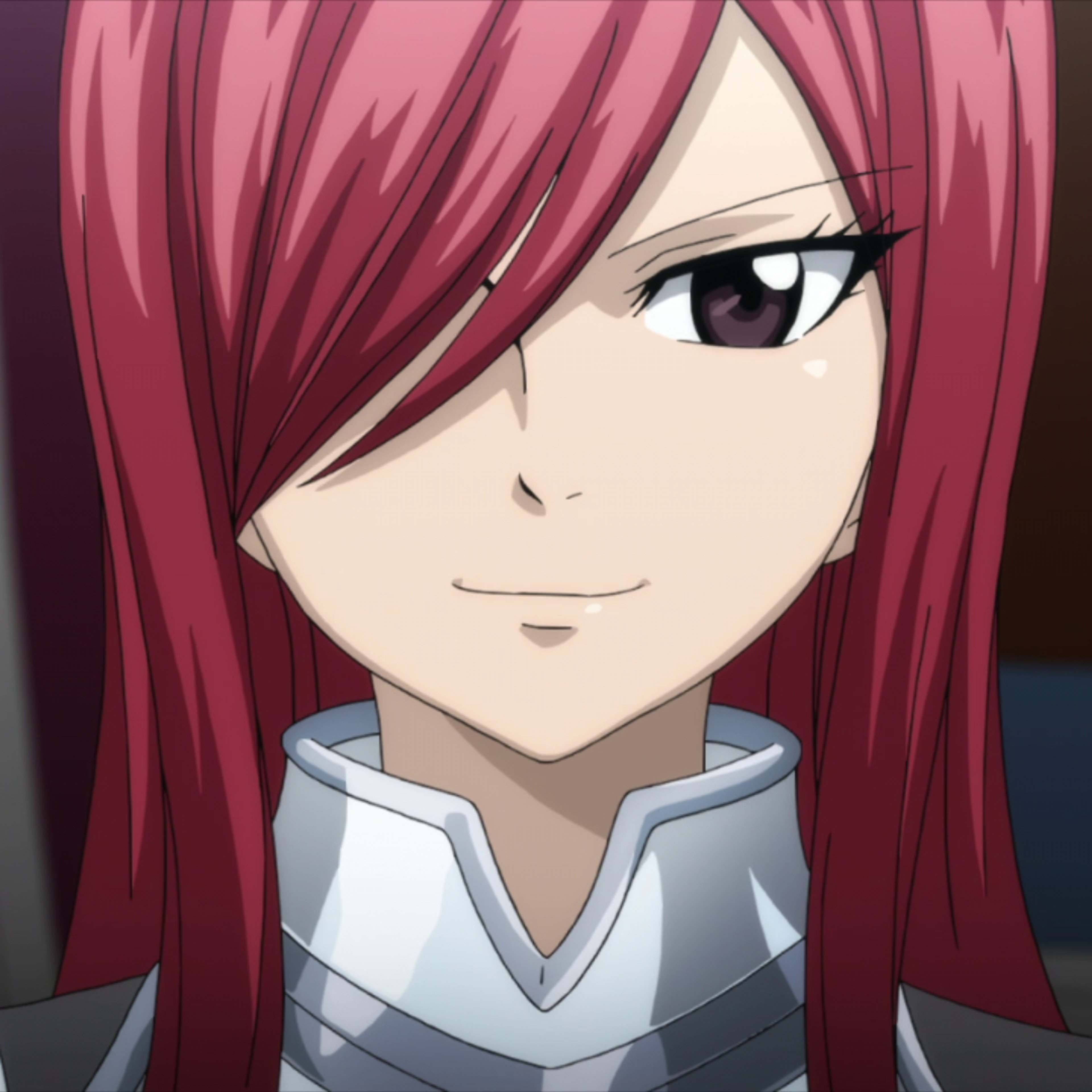 A young woman with red hair wearing silver armor