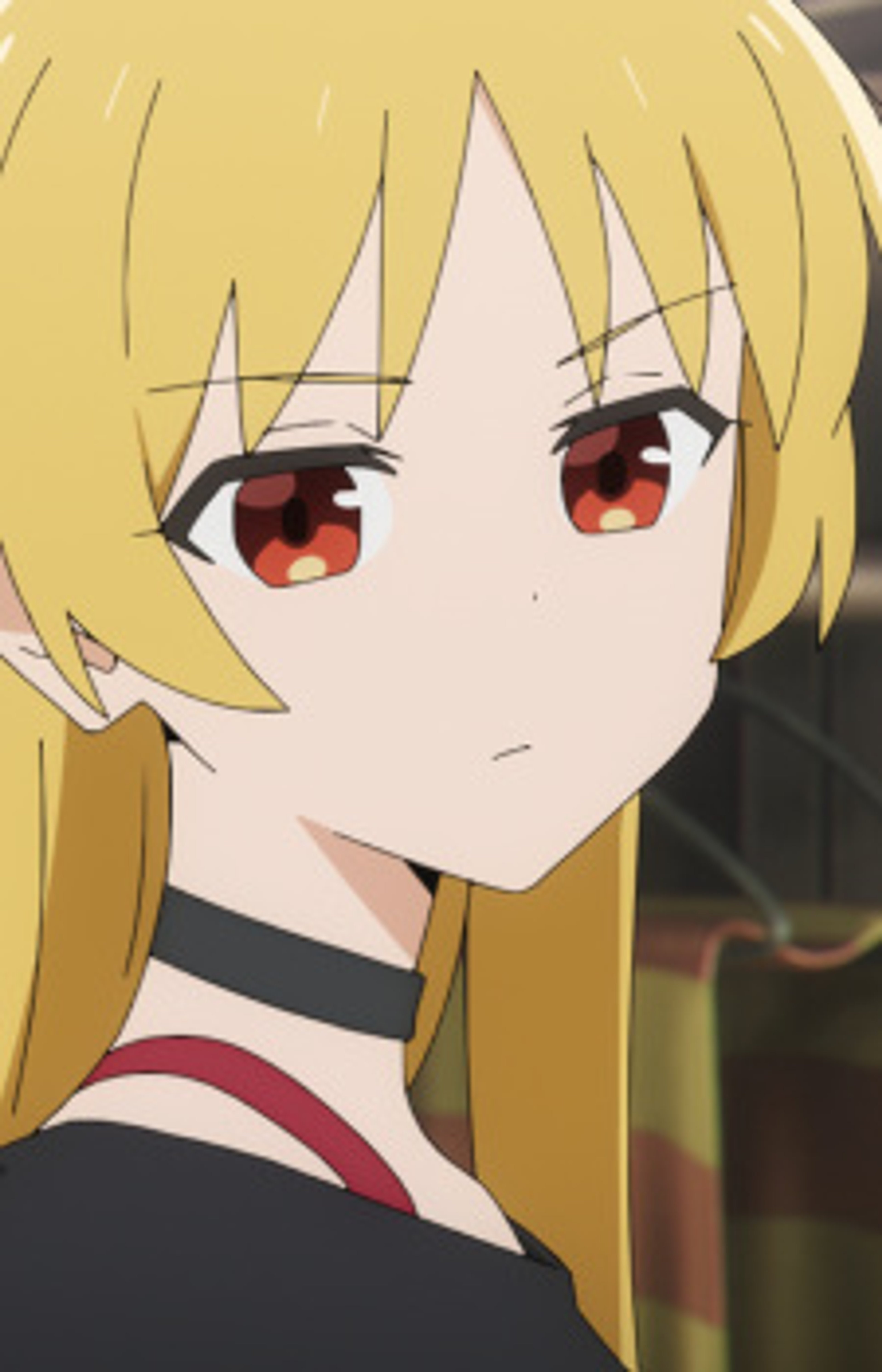 A young woman with blonde hair and red eyes wearing a black outfit