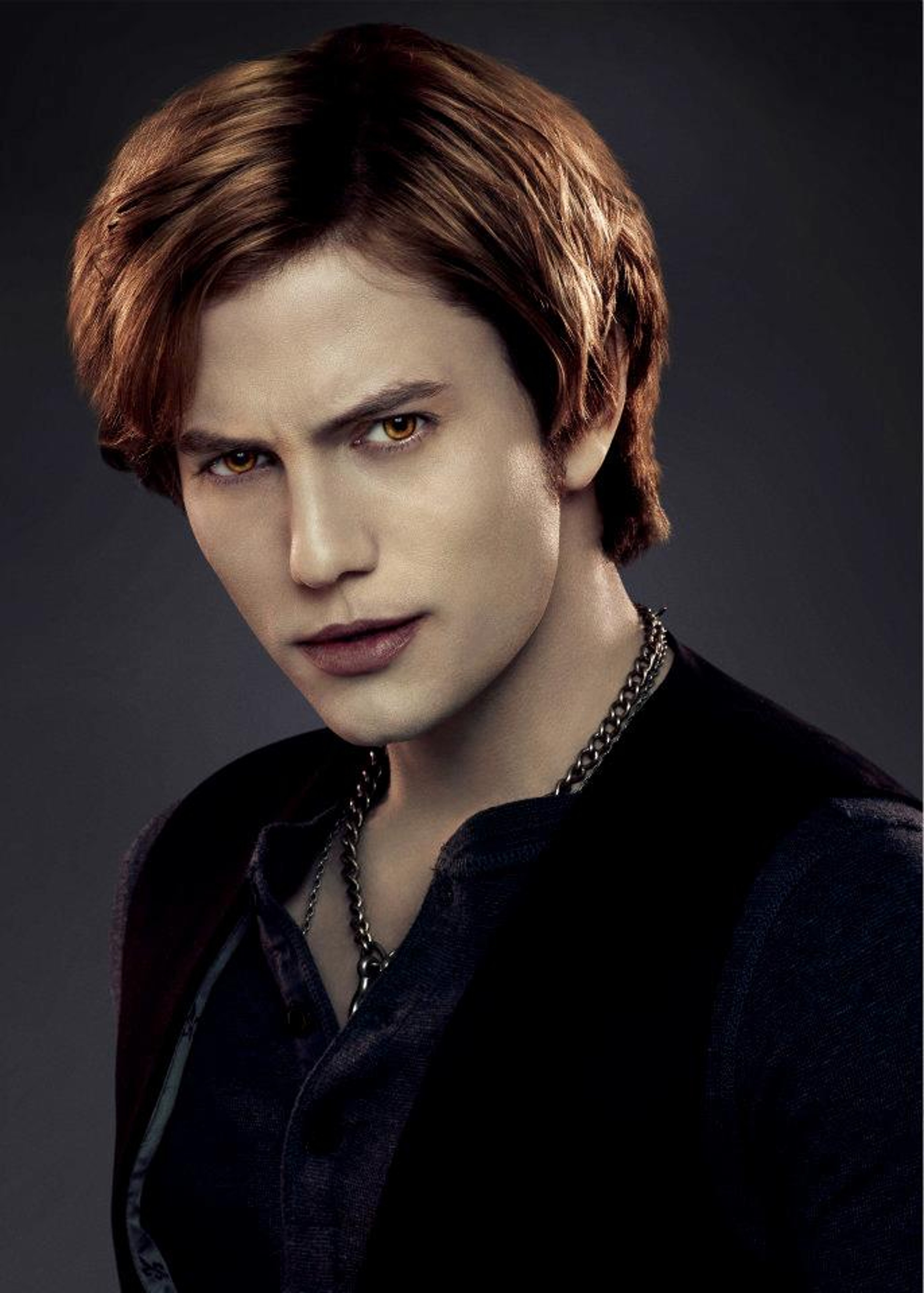 A man with honey blond hair and a serious expression, appearing to be a vampire character from the Twilight universe.