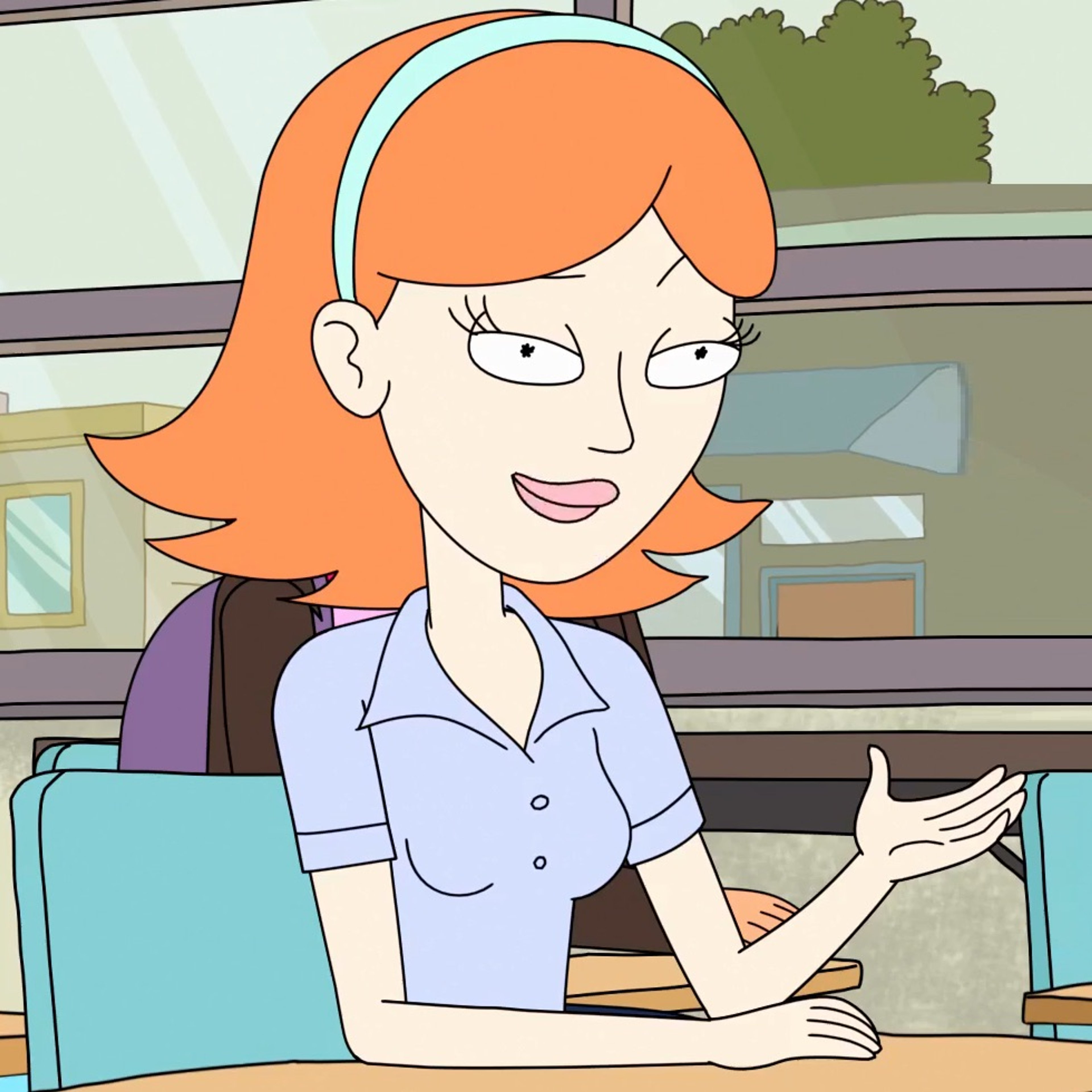 A cartoon image of a young woman with ginger hair sitting at a desk or table.