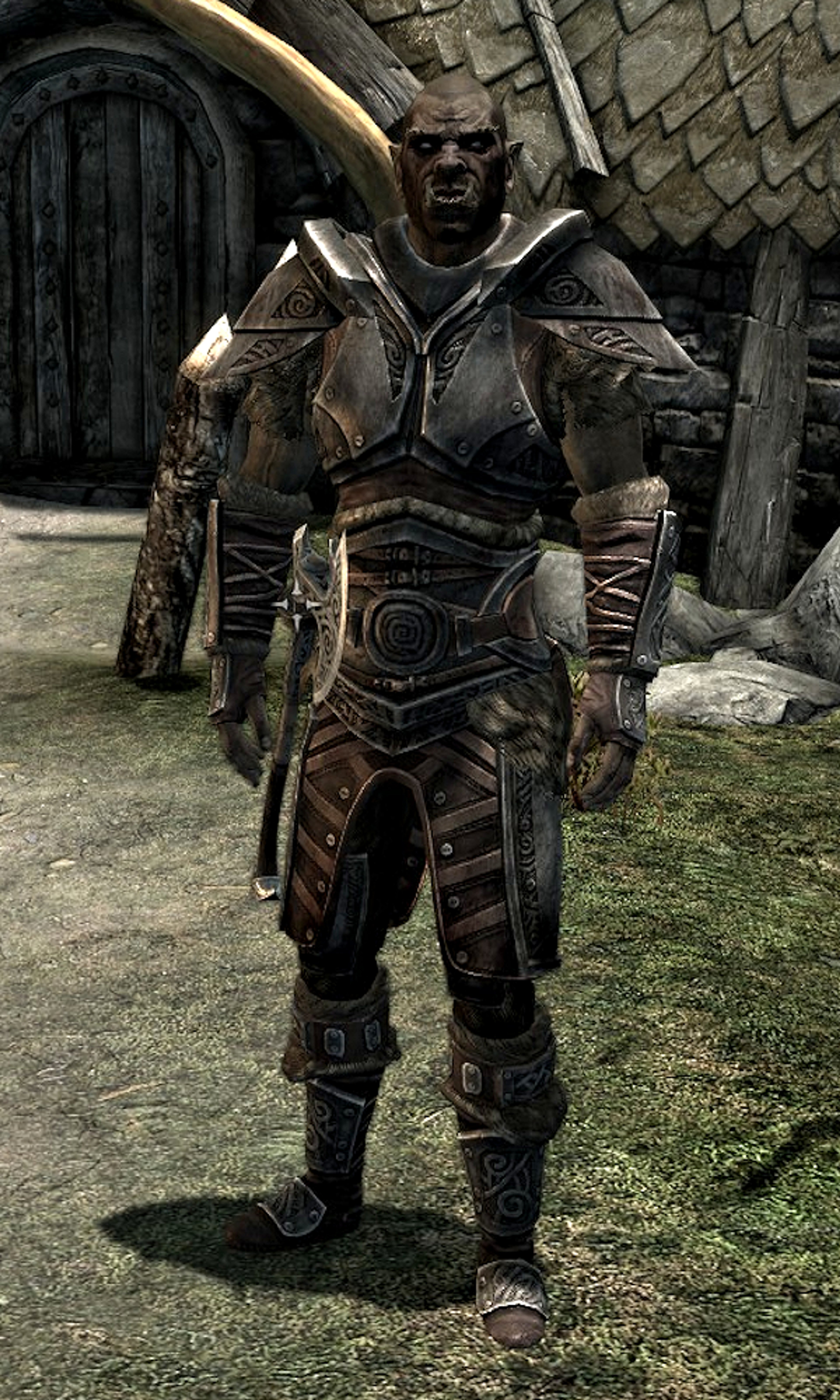 A grizzled Orcish warrior in heavy armor, holding a battle axe.
