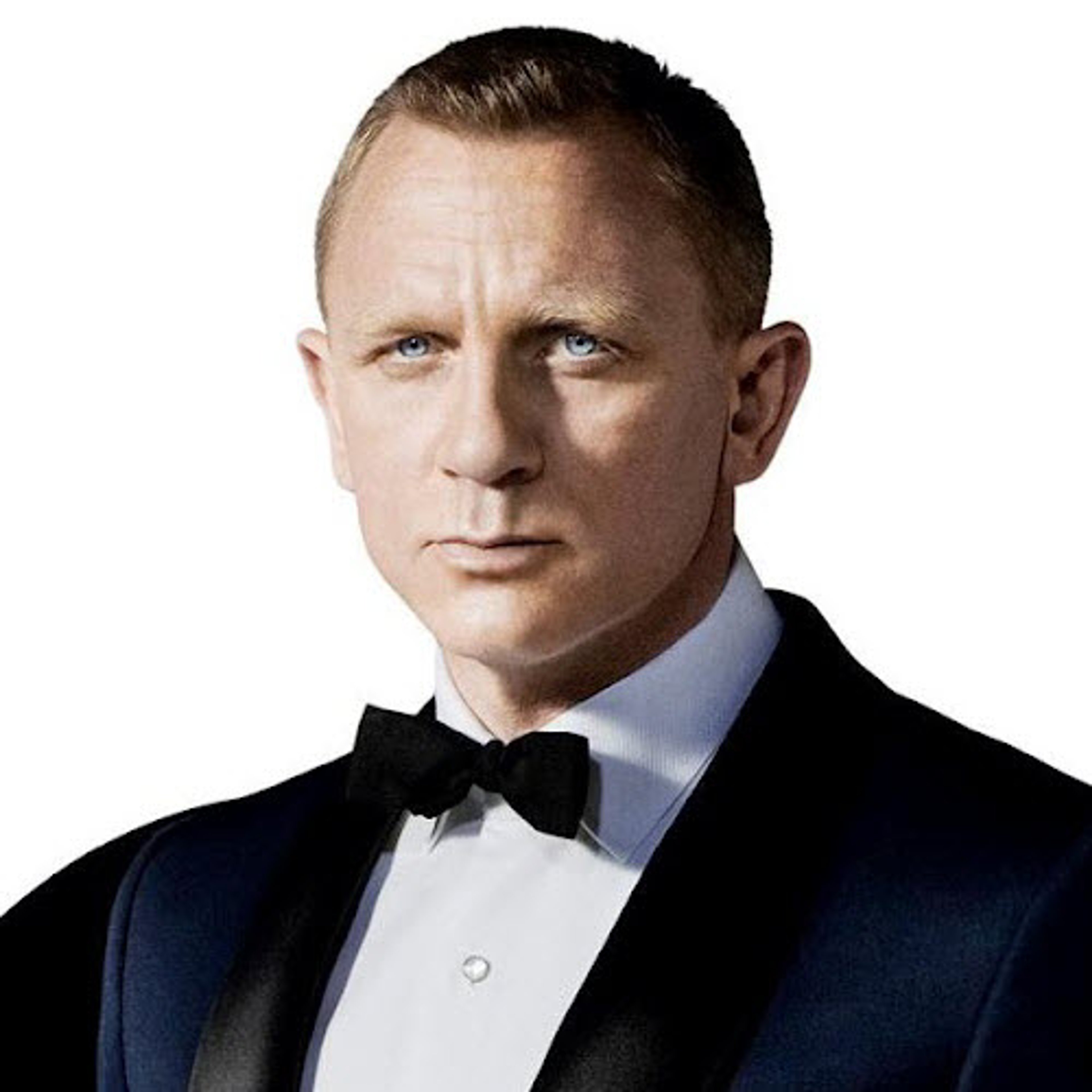 A man in a tuxedo with a serious expression