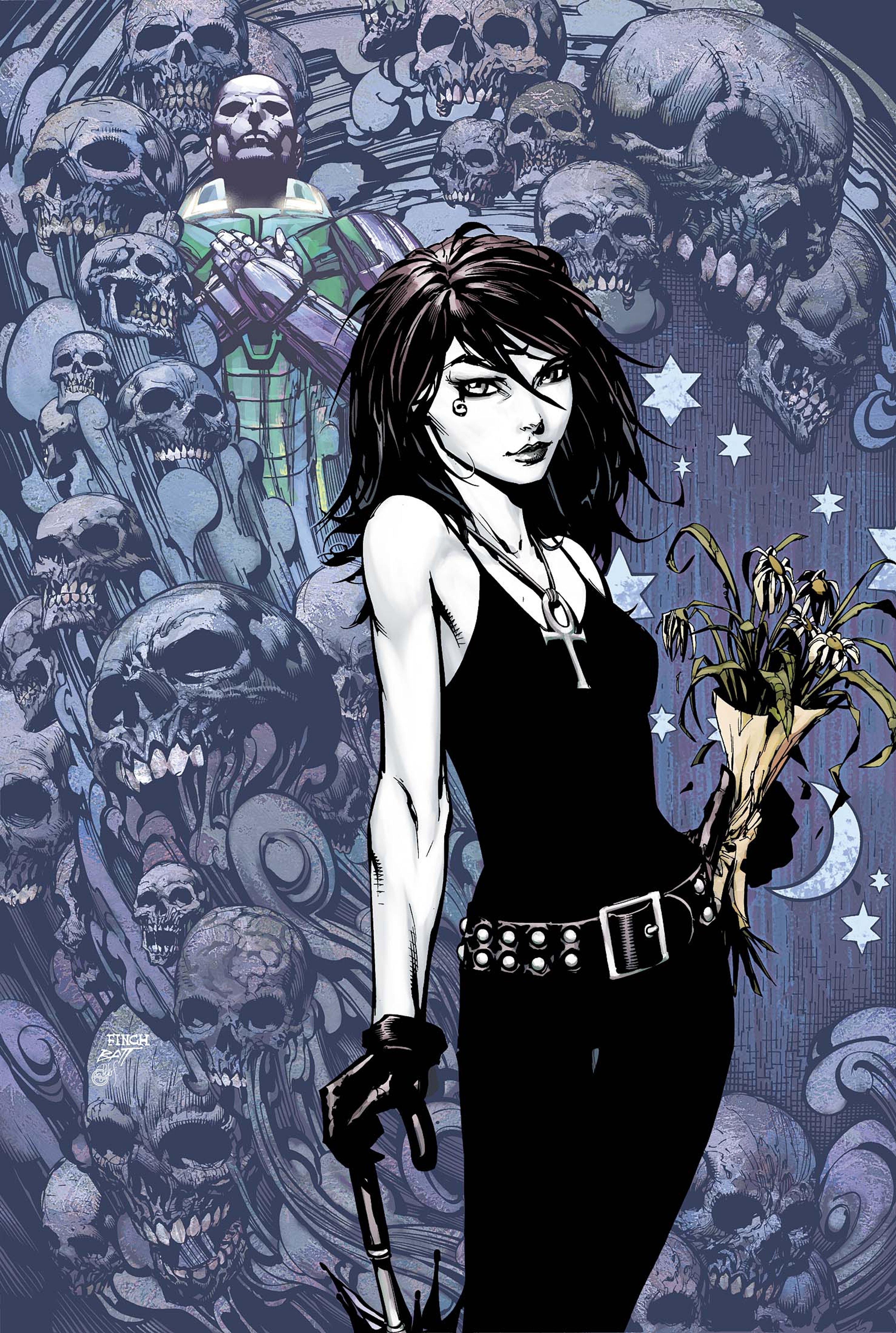 A young, pale woman with dark hair dressed in a black outfit, surrounded by skulls and gothic imagery.