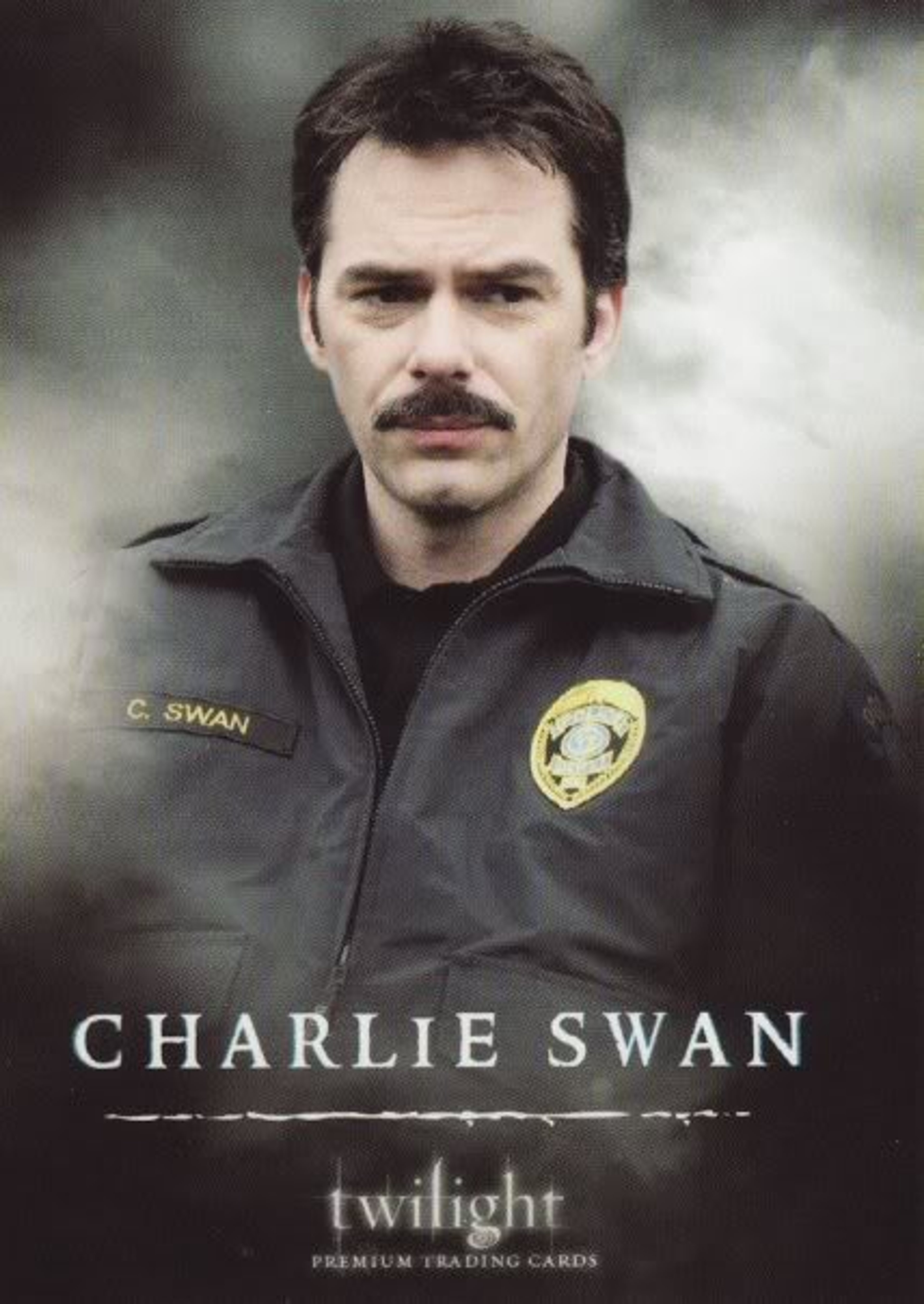 A man in a police uniform with the name 'C. Swan' on the badge