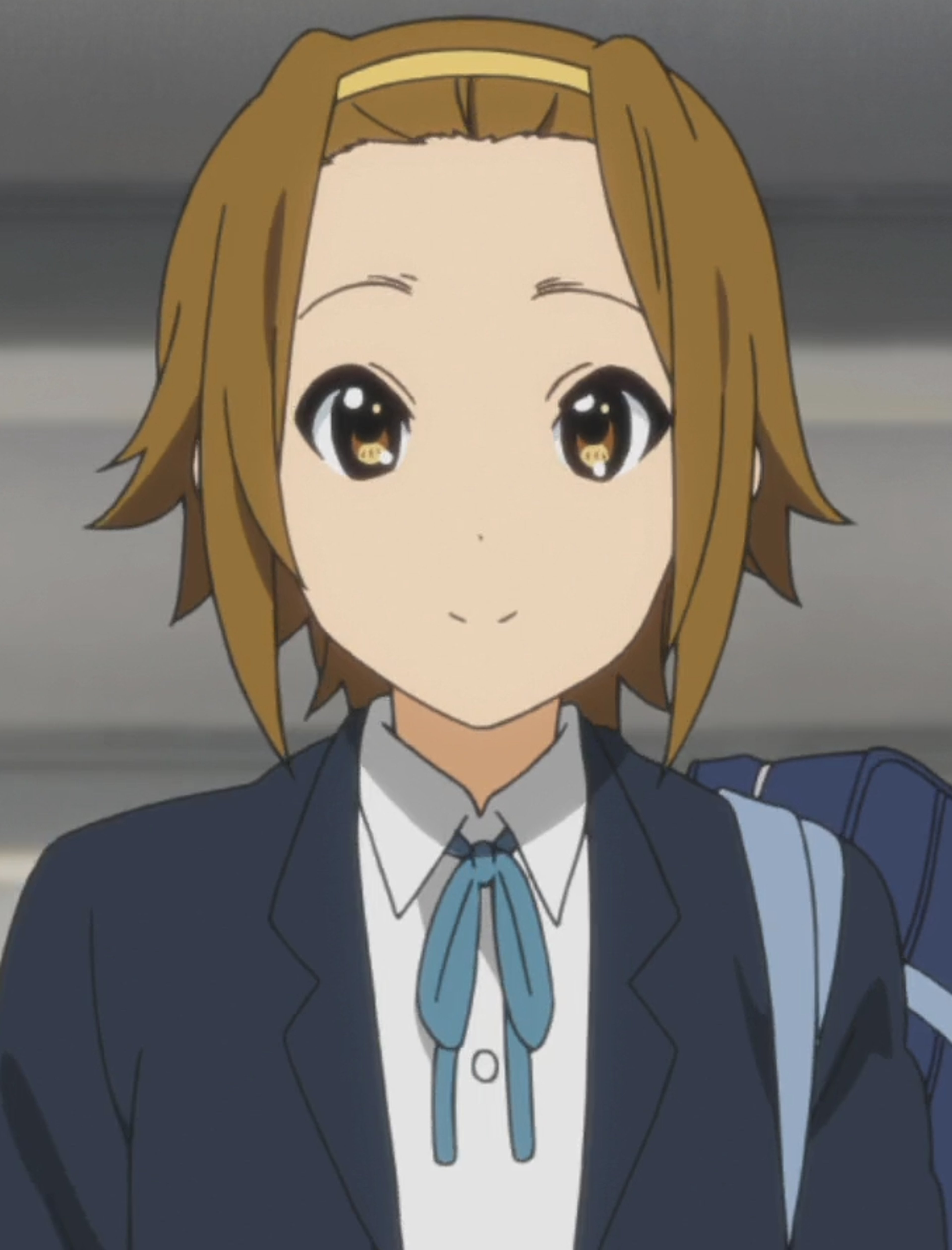 An anime-style character with brown hair and a school uniform