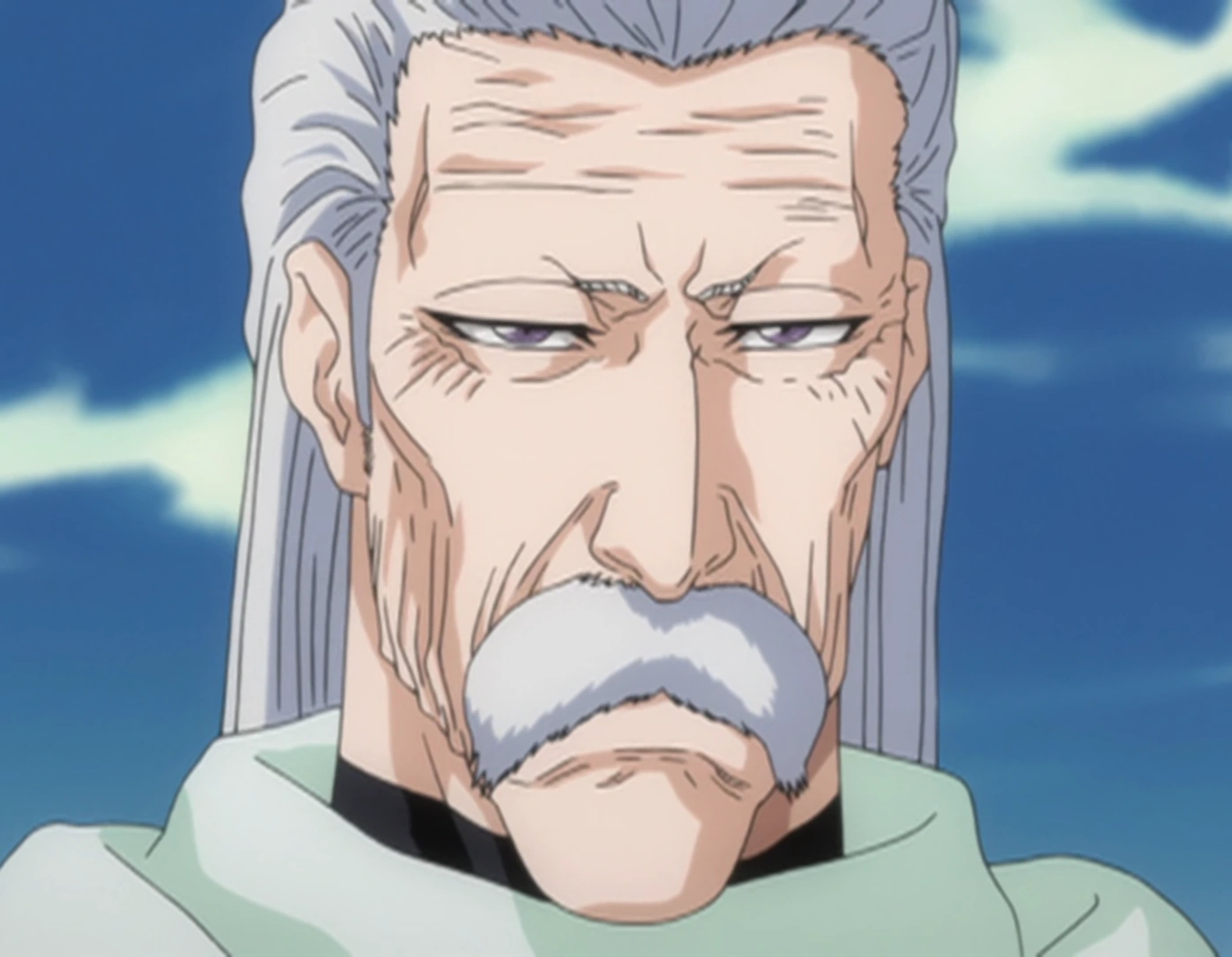 An elderly man with a serious expression, wearing traditional Japanese clothing