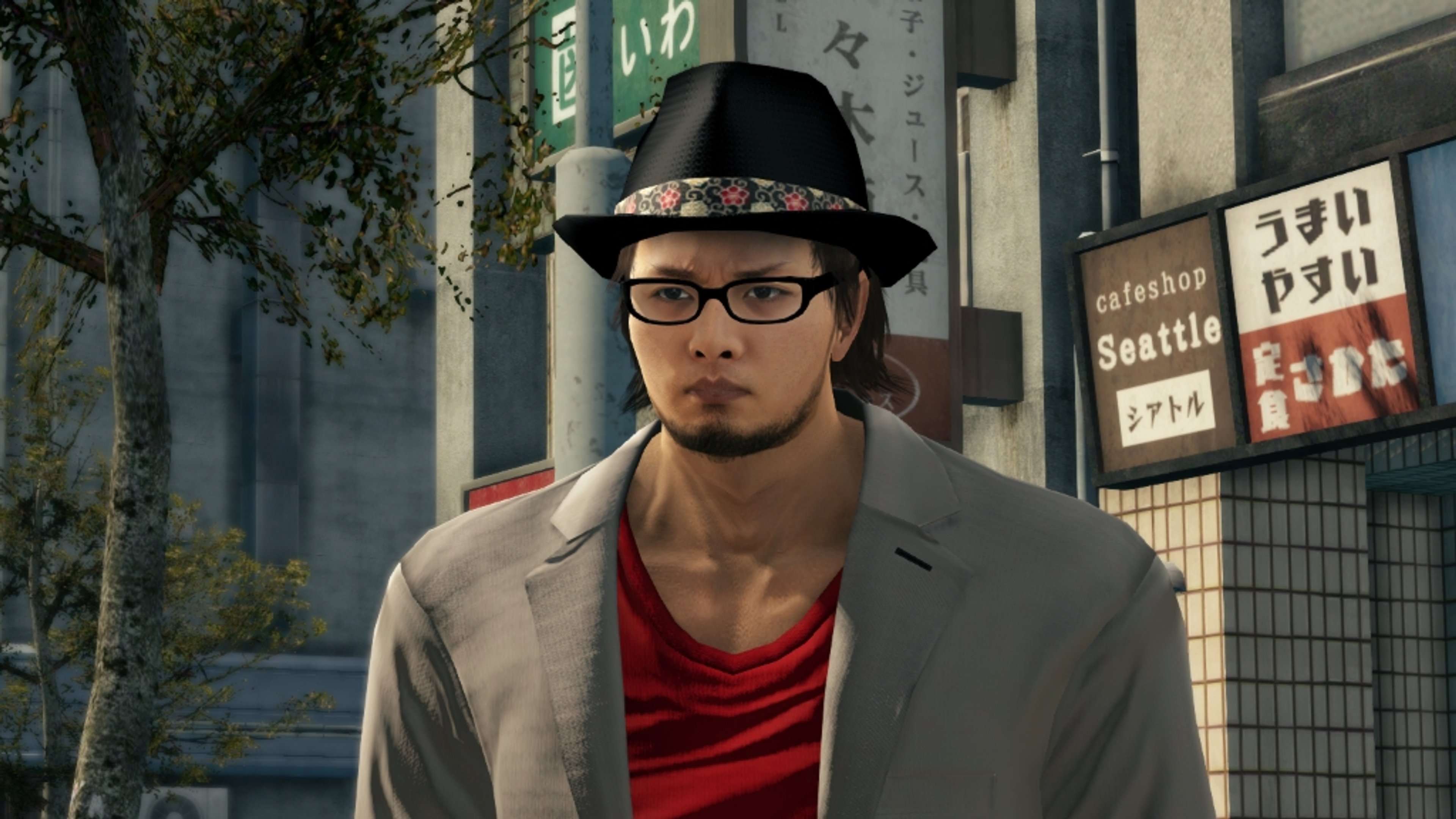A tall, muscular man in a dark suit, fedora, and glasses with an imposing presence