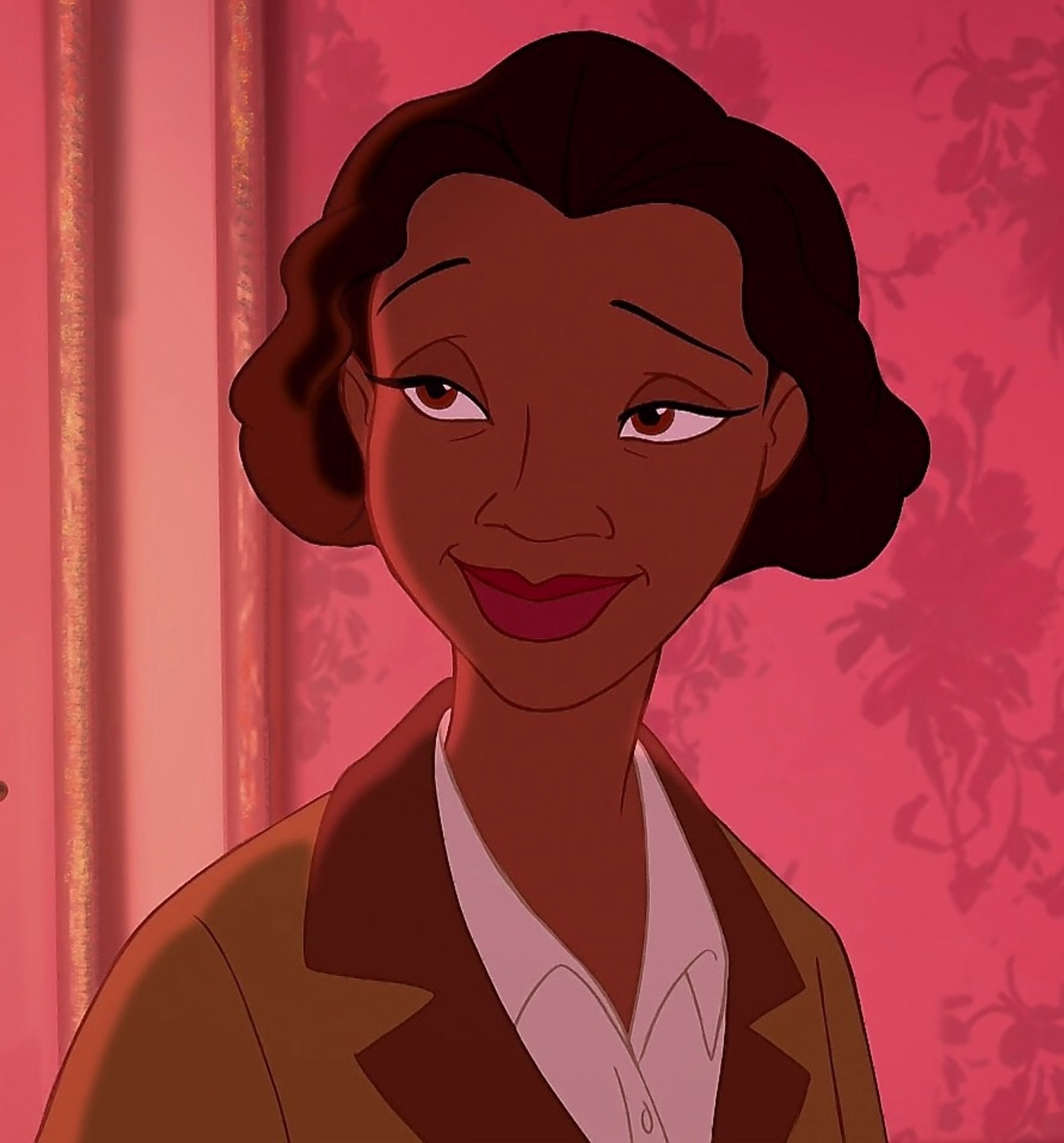 An animated Black woman with a warm, friendly expression wearing a light-colored blouse.