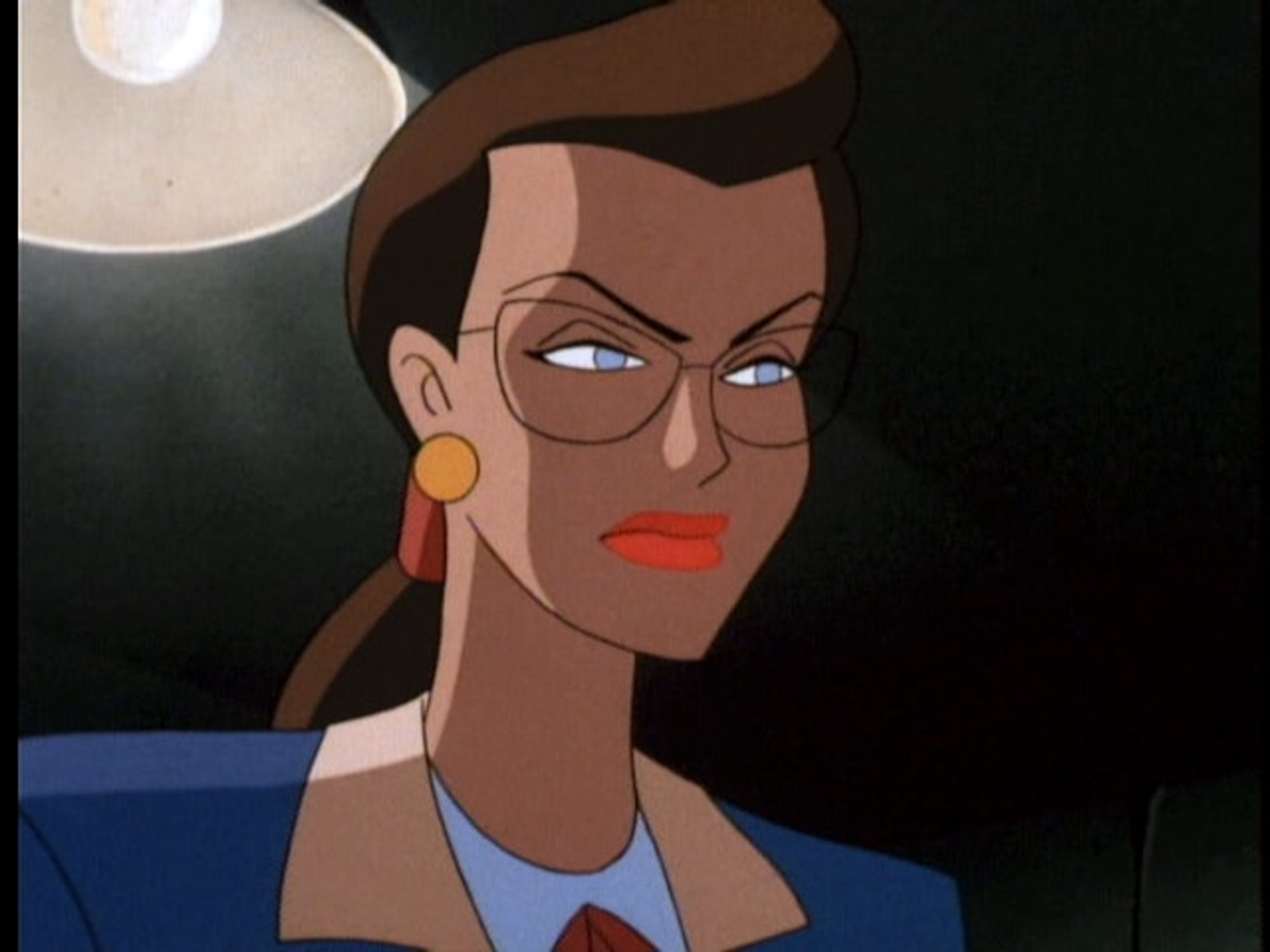 A serious-looking woman in a blue suit