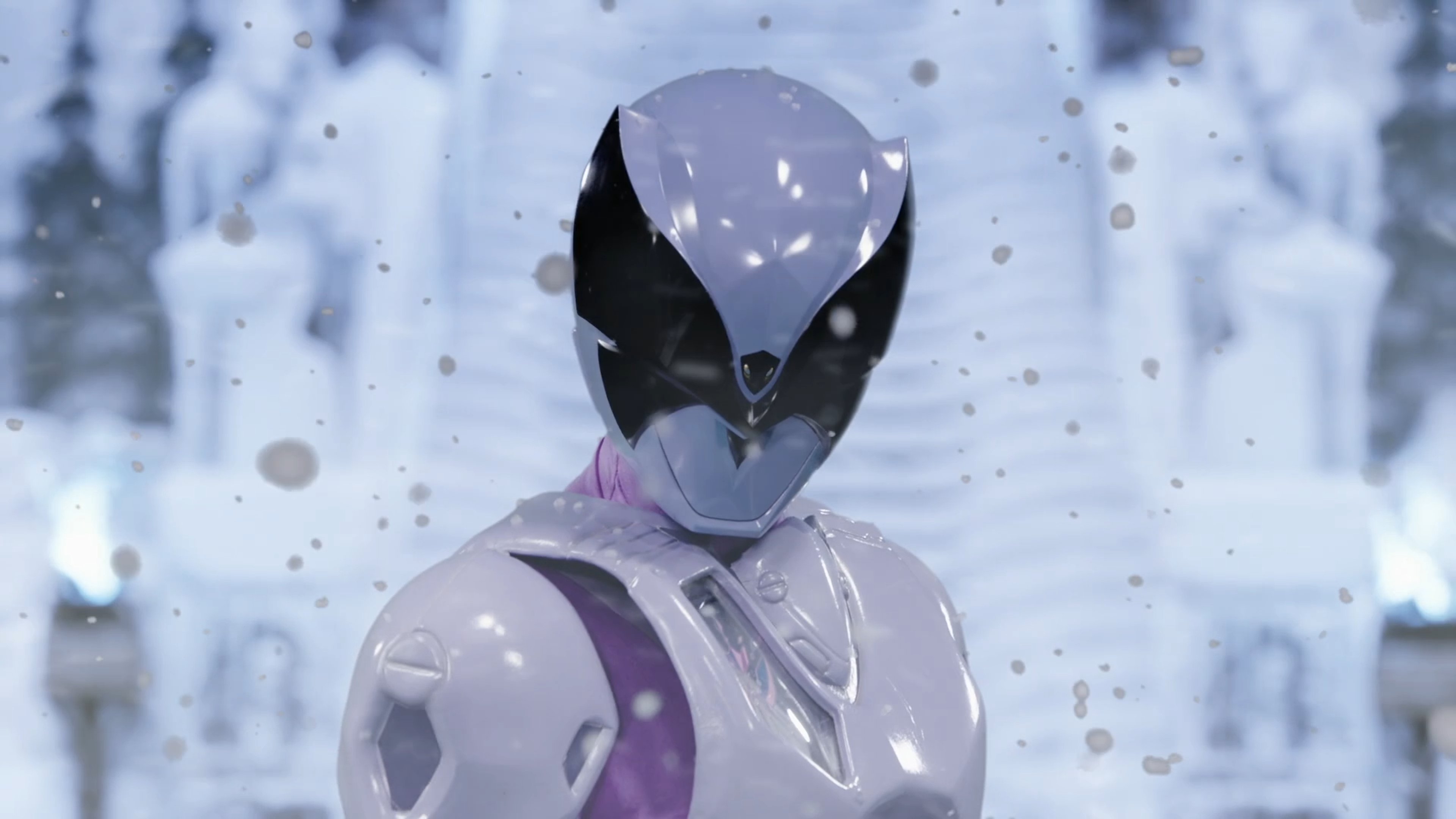 A female character in a black and purple futuristic costume with a mask, standing in a snowy winter setting.