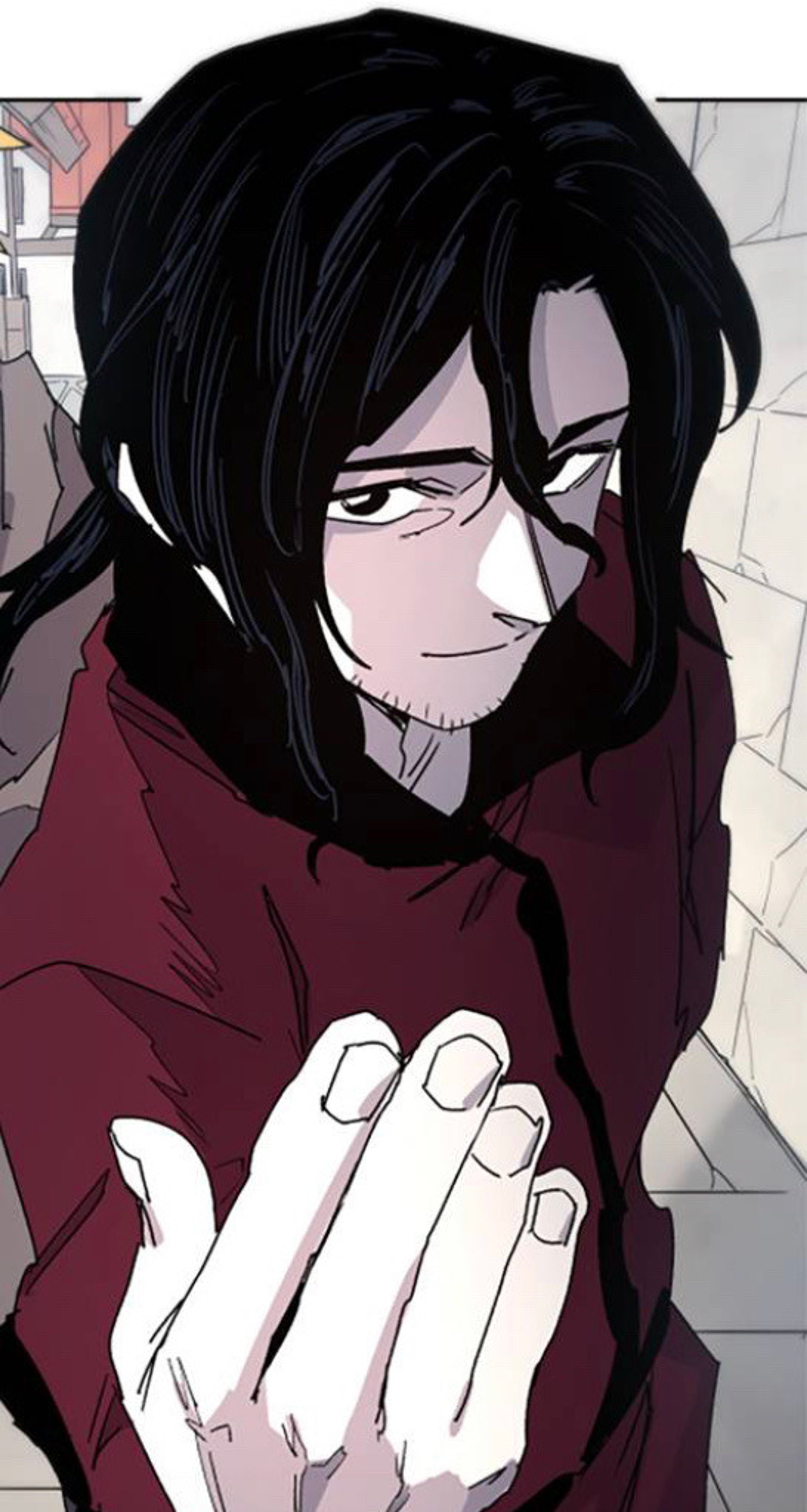 A middle-aged man with a muscular build, long black hair, and a red cloak, with an intense and haunted expression.