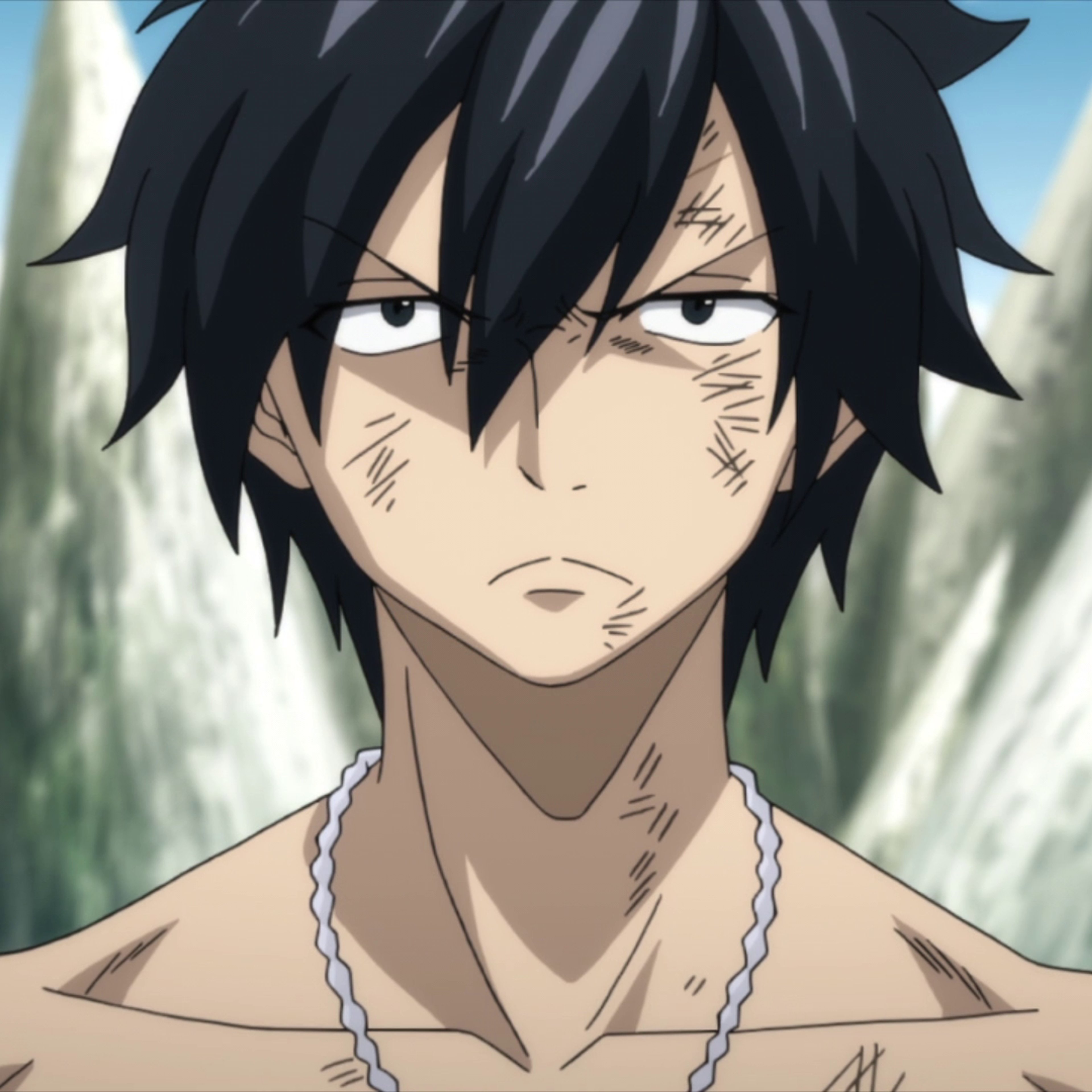 A young man with spiky black hair and a muscular build, wearing a necklace and appearing shirtless in an outdoor setting.