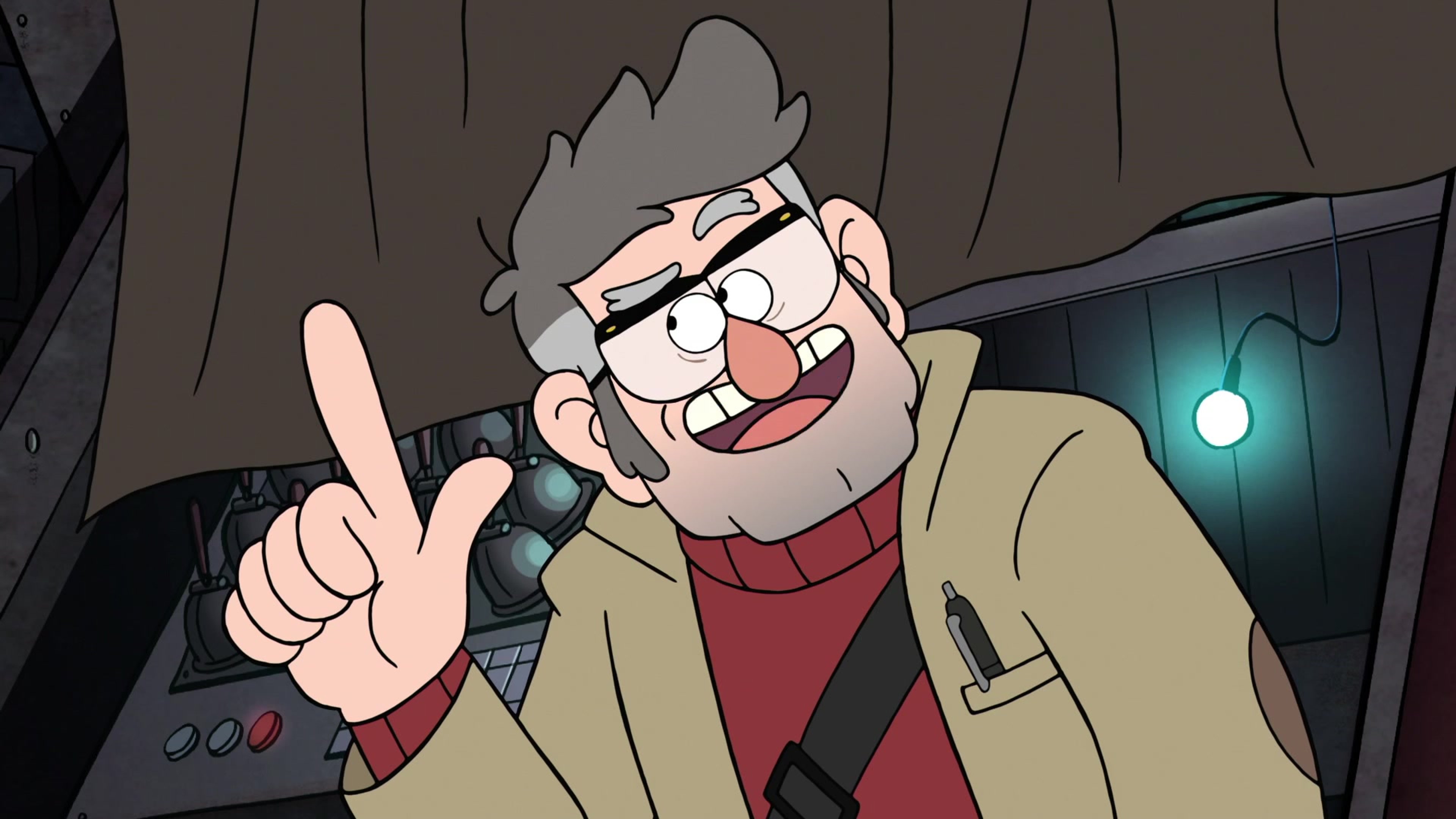 An older man with gray hair and glasses making a mischievous hand gesture