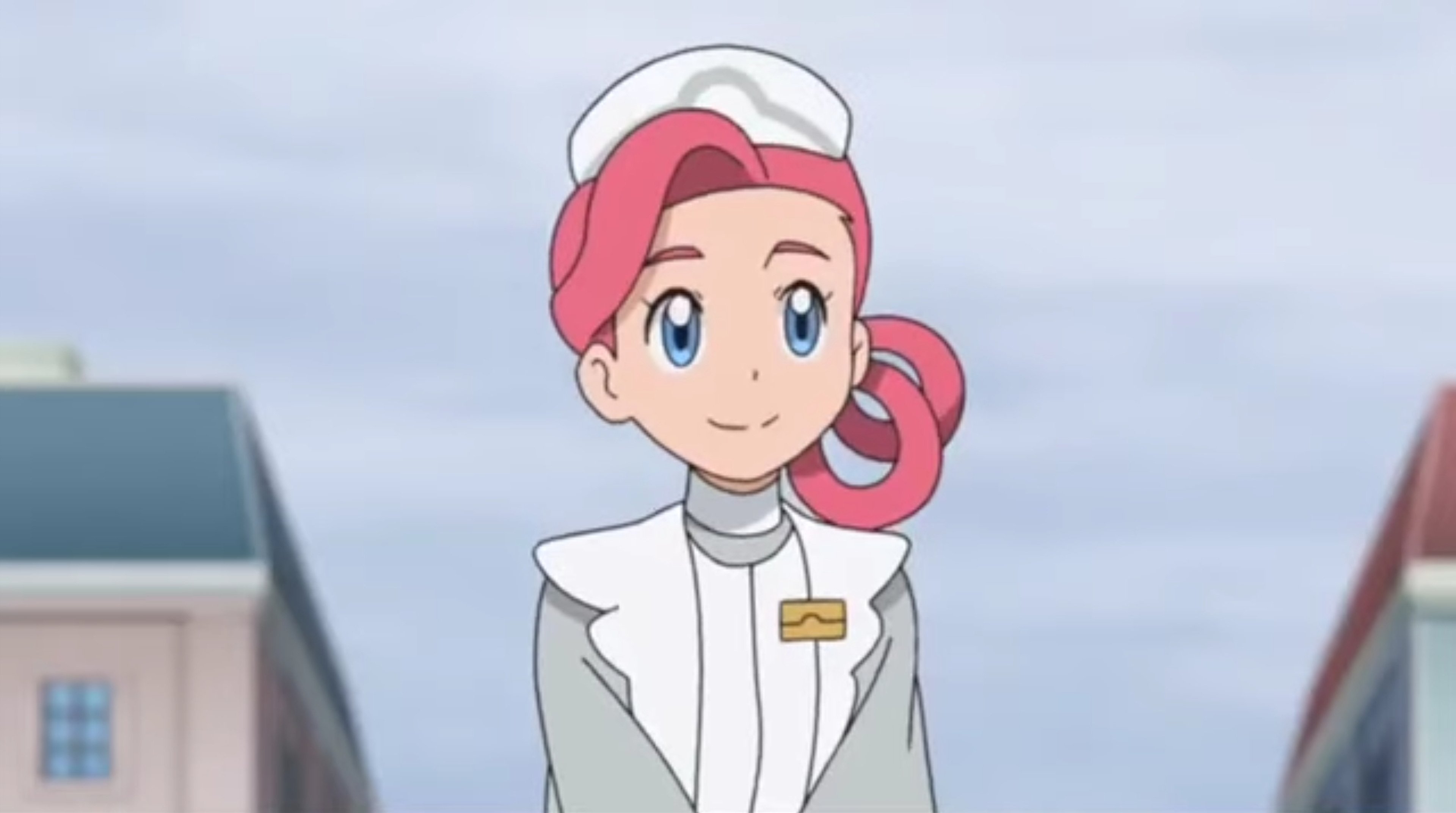 An anime character named Nurse Joy, a pink-haired woman in a nurse's uniform, standing in front of a Pokémon Center.