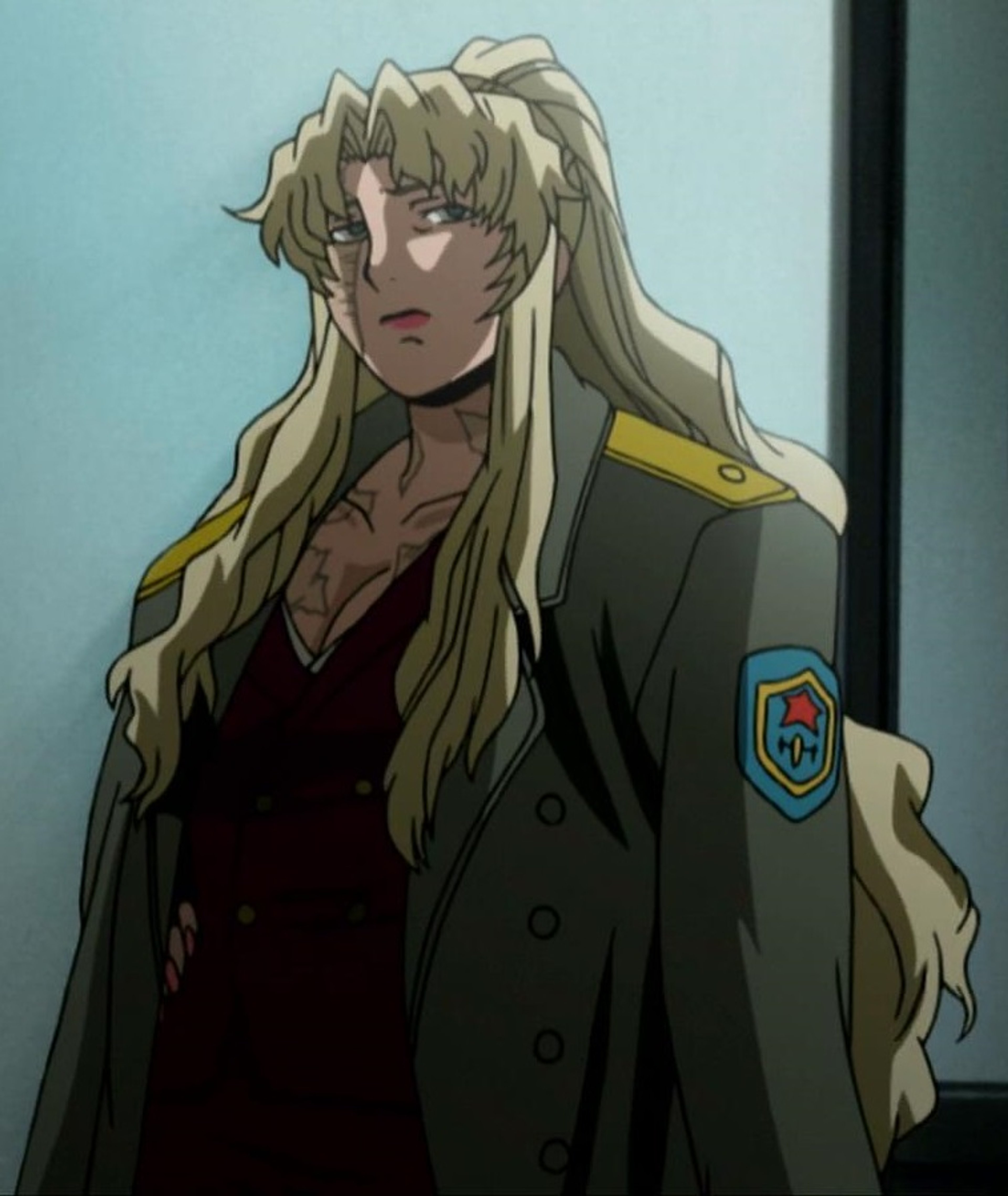 A blonde-haired, blue-eyed woman with a prominent facial scar, wearing a dark military-style coat