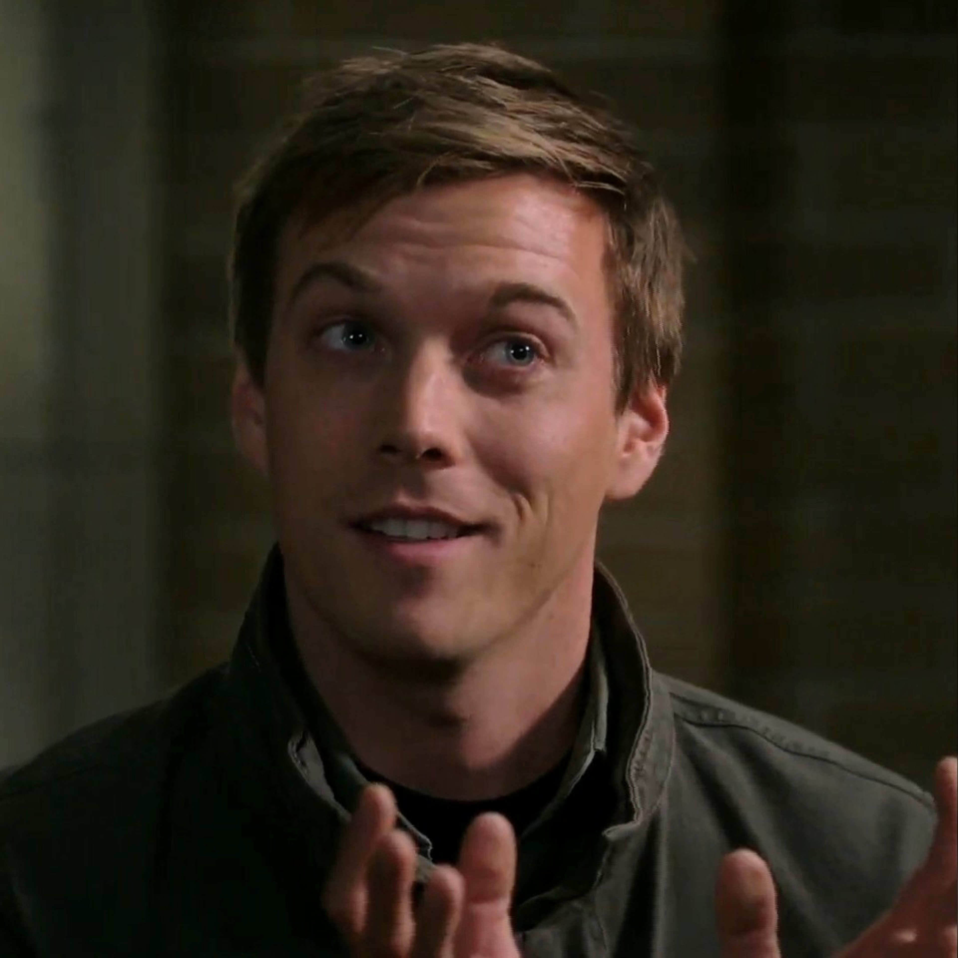 A young man with short brown hair and blue eyes looking at the camera with a friendly expression.