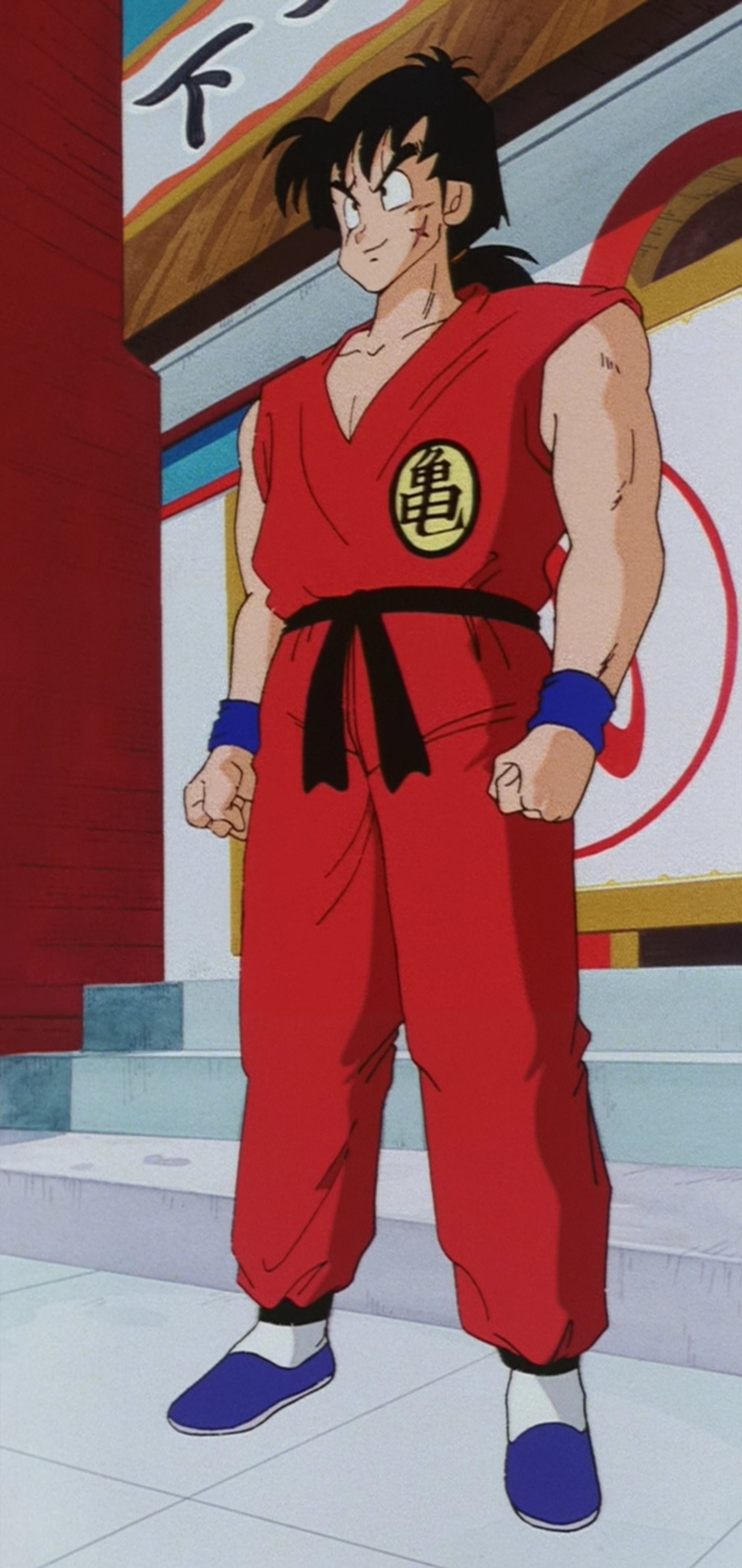 An anime character in a red martial arts uniform standing in a fighting stance