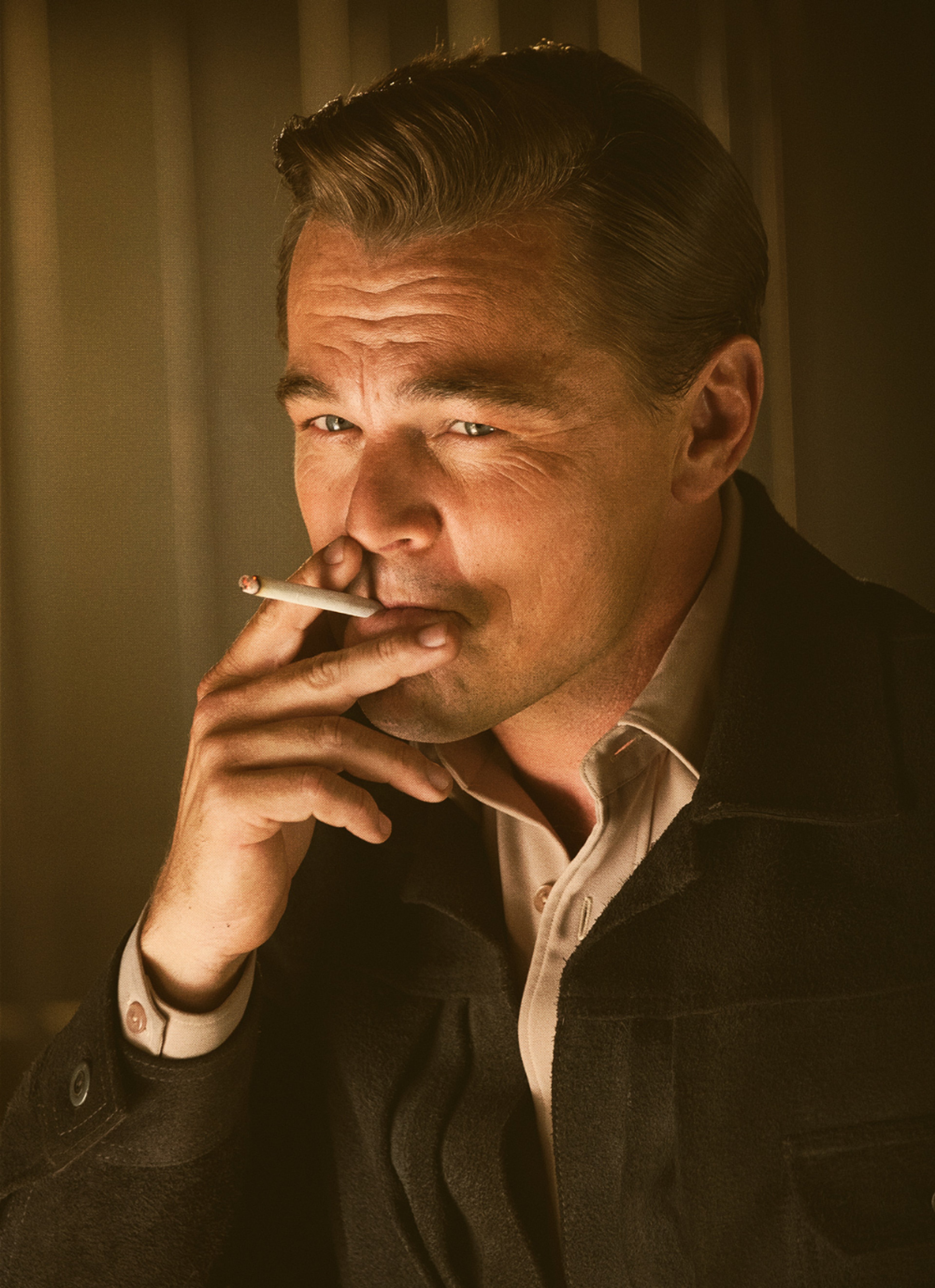 A middle-aged man with a serious expression, smoking a cigarette