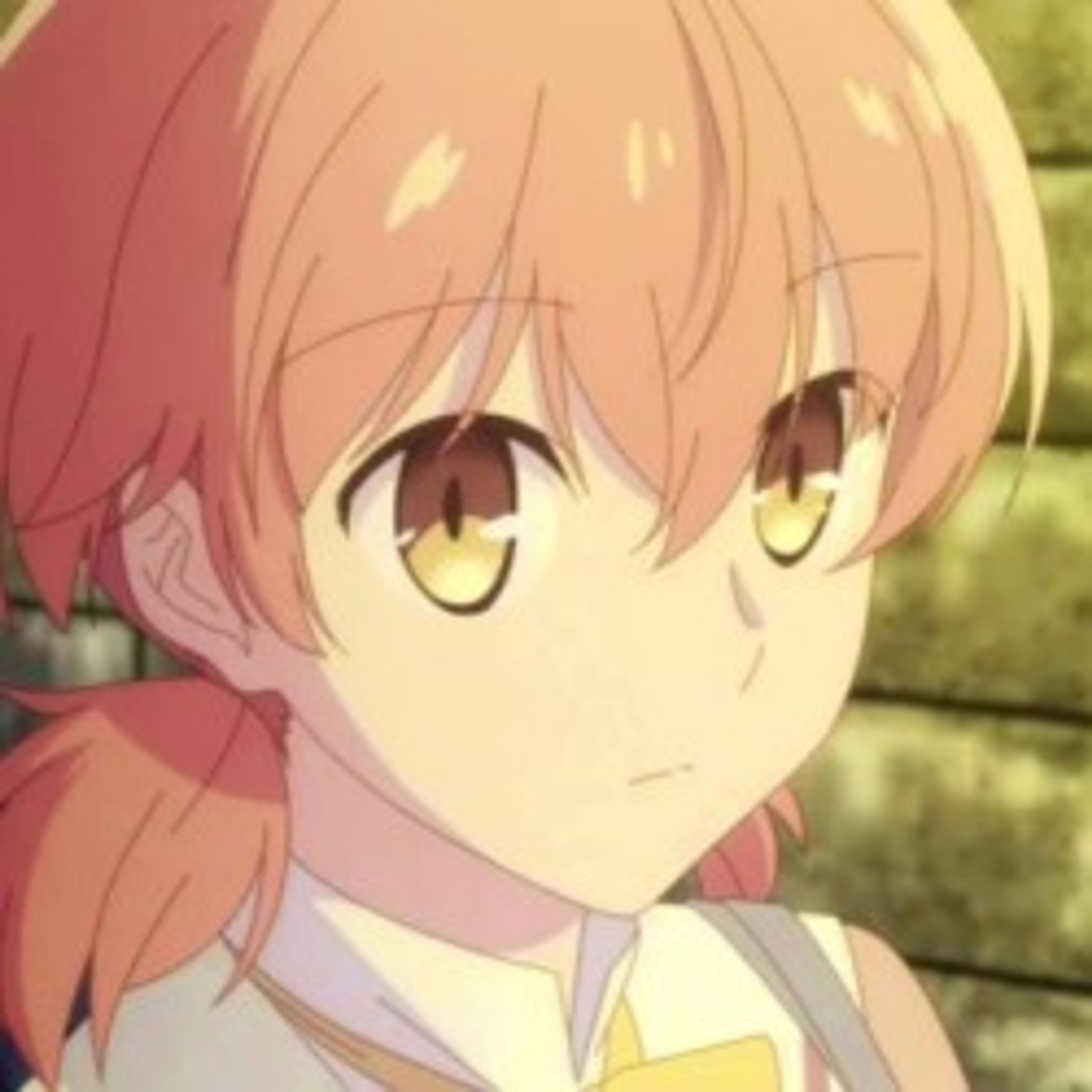 A young woman with pink hair in two ponytails wearing a school uniform