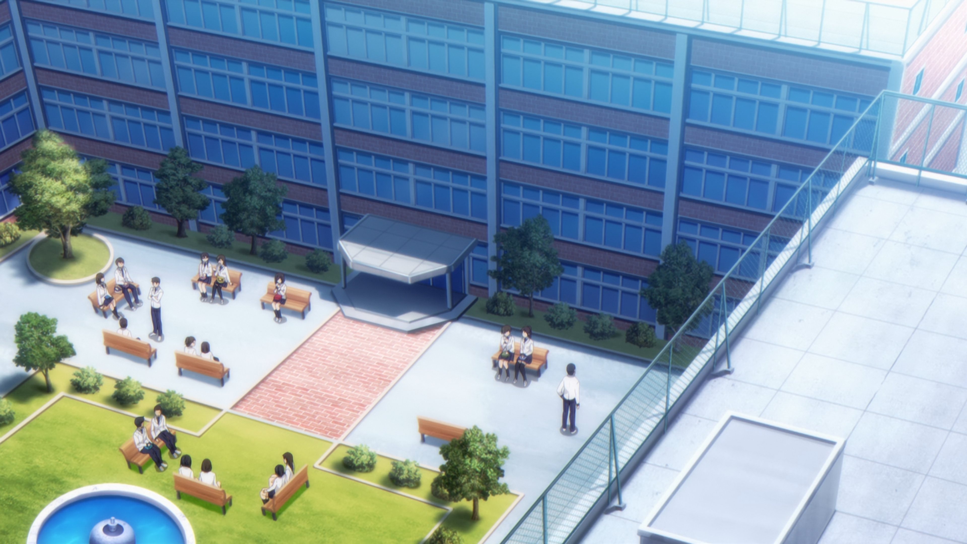 A detailed view of a high school campus with a large building, trees, and people walking around in the courtyard.