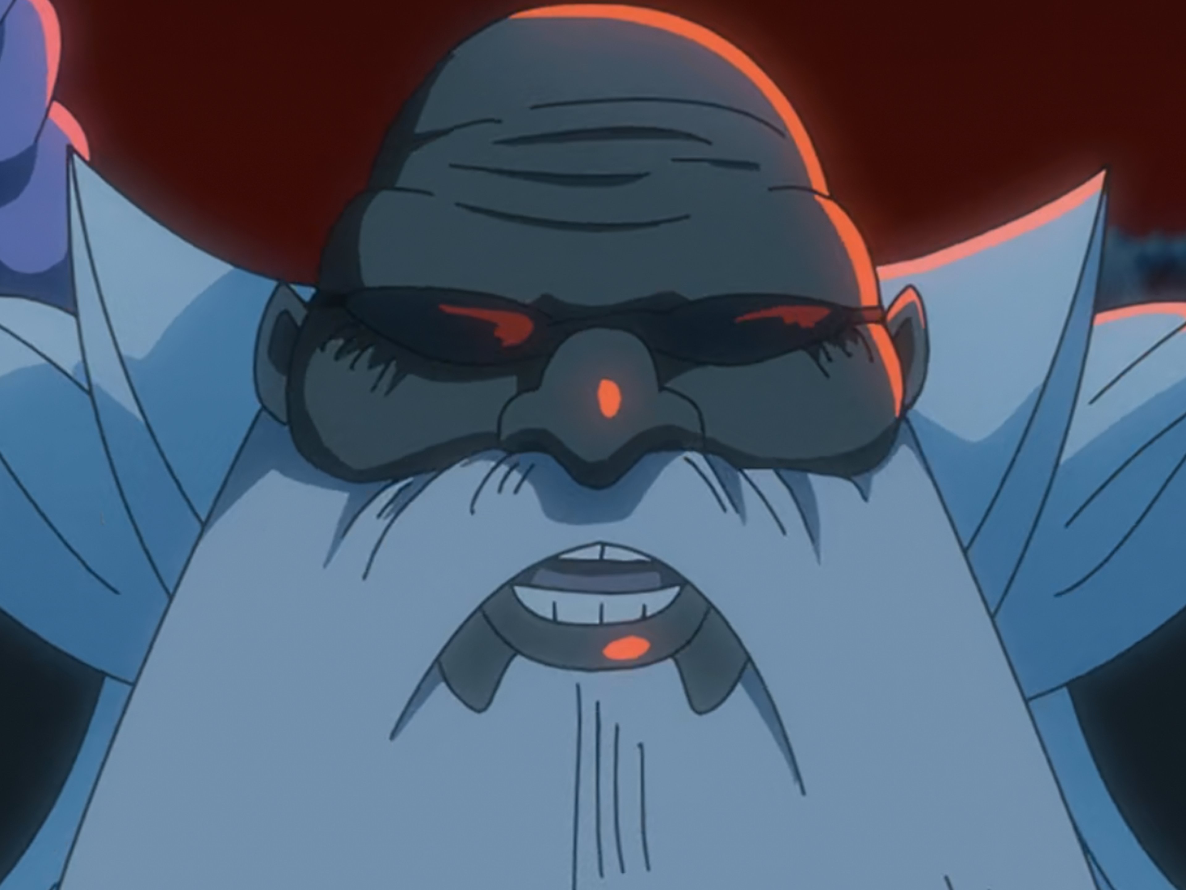 A short, obese, and brown-skinned Quincy character with a long white beard and dark sunglasses