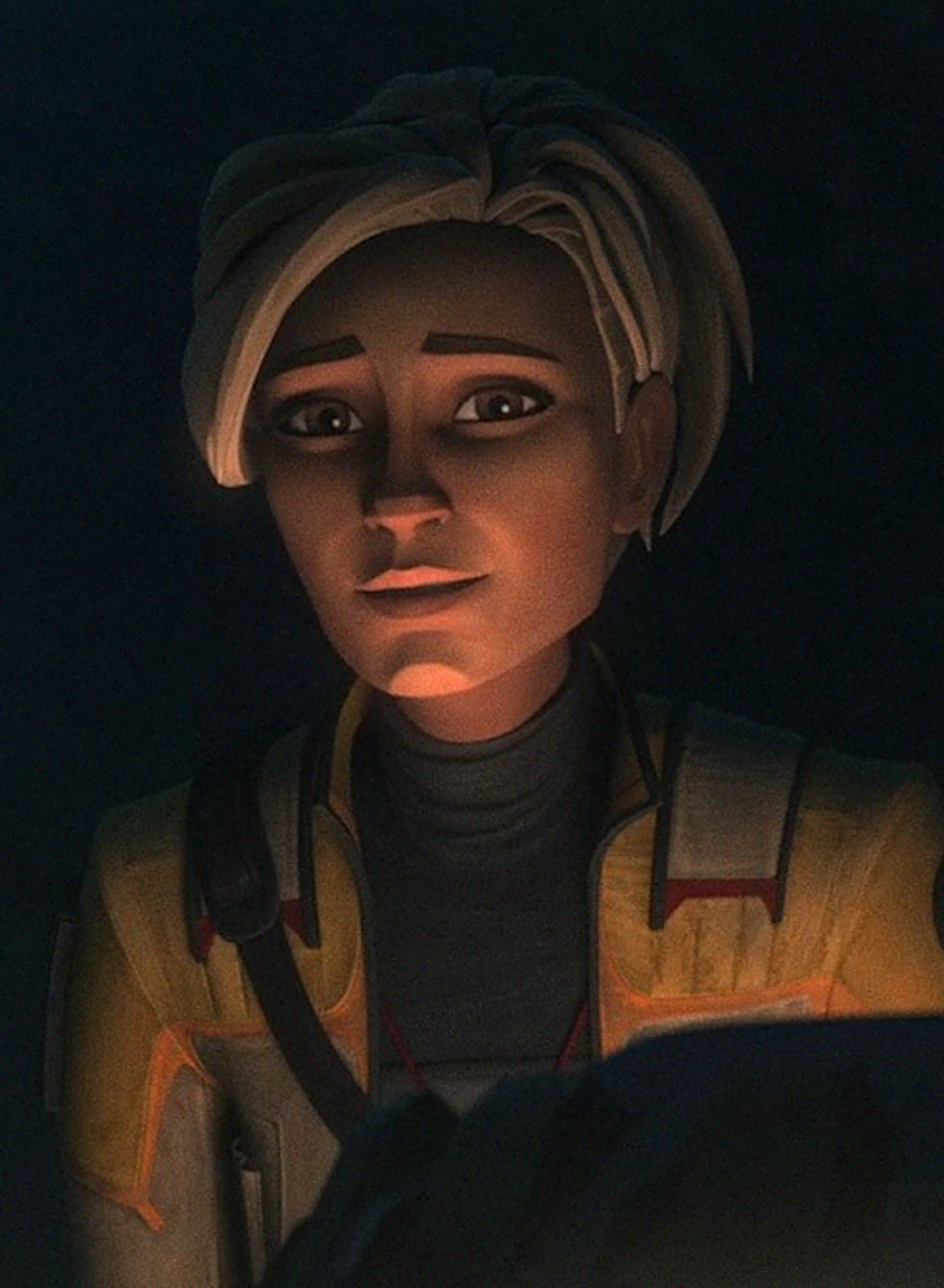 A young female character with blonde hair in a dark colored outfit