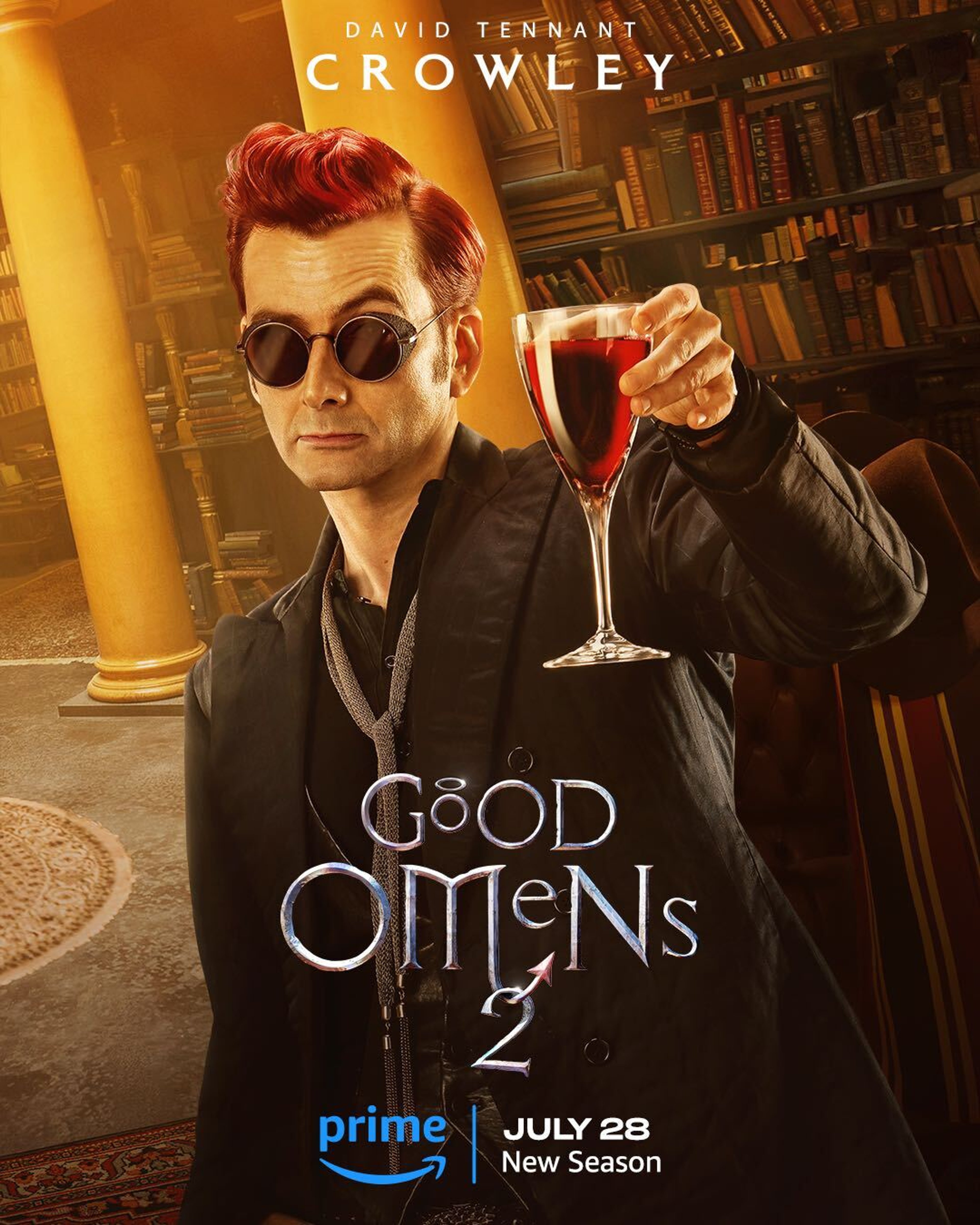 A man with red hair and sunglasses holding a glass of red wine