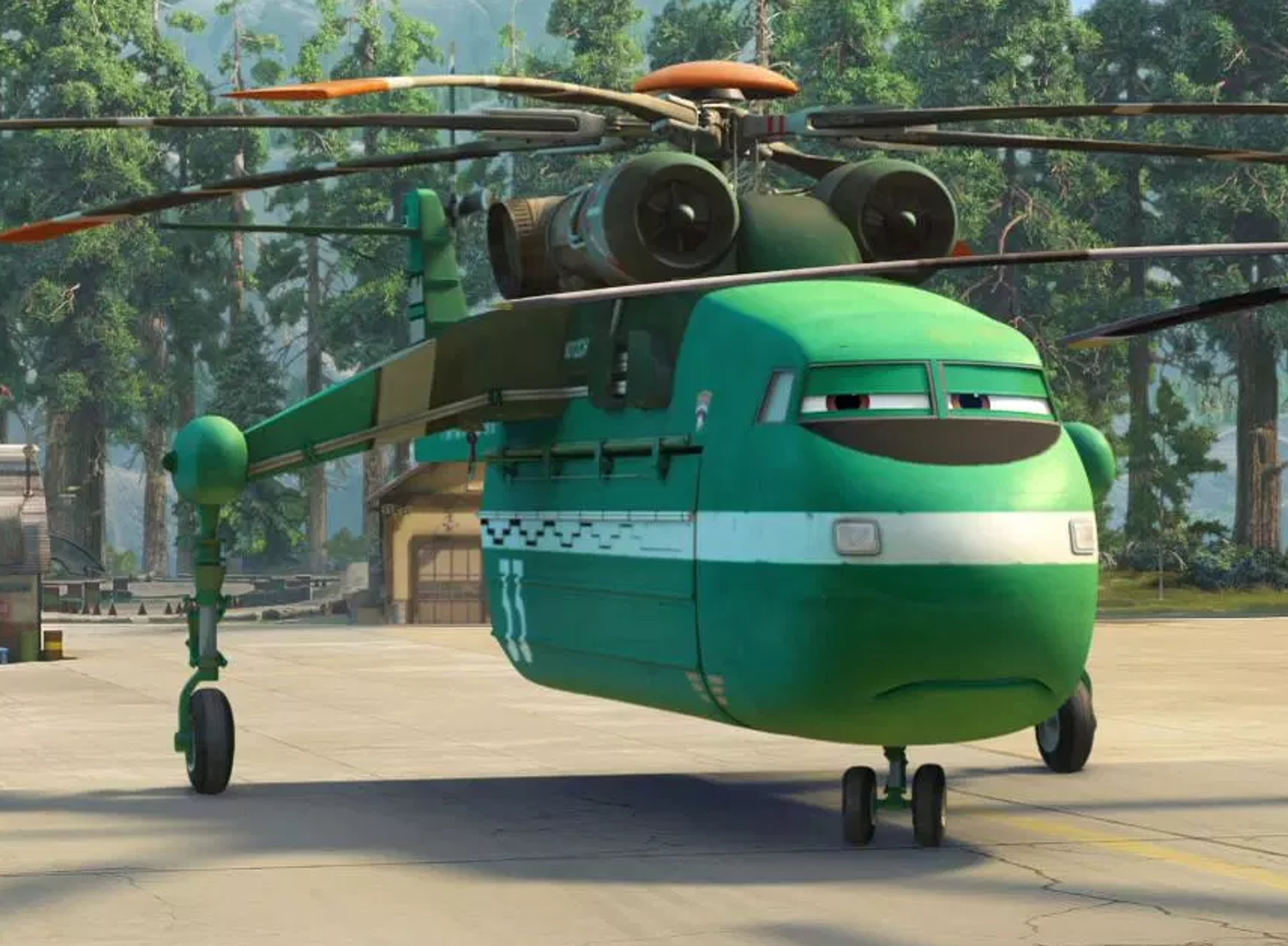 A large green helicopter with multiple rotors in an outdoor setting