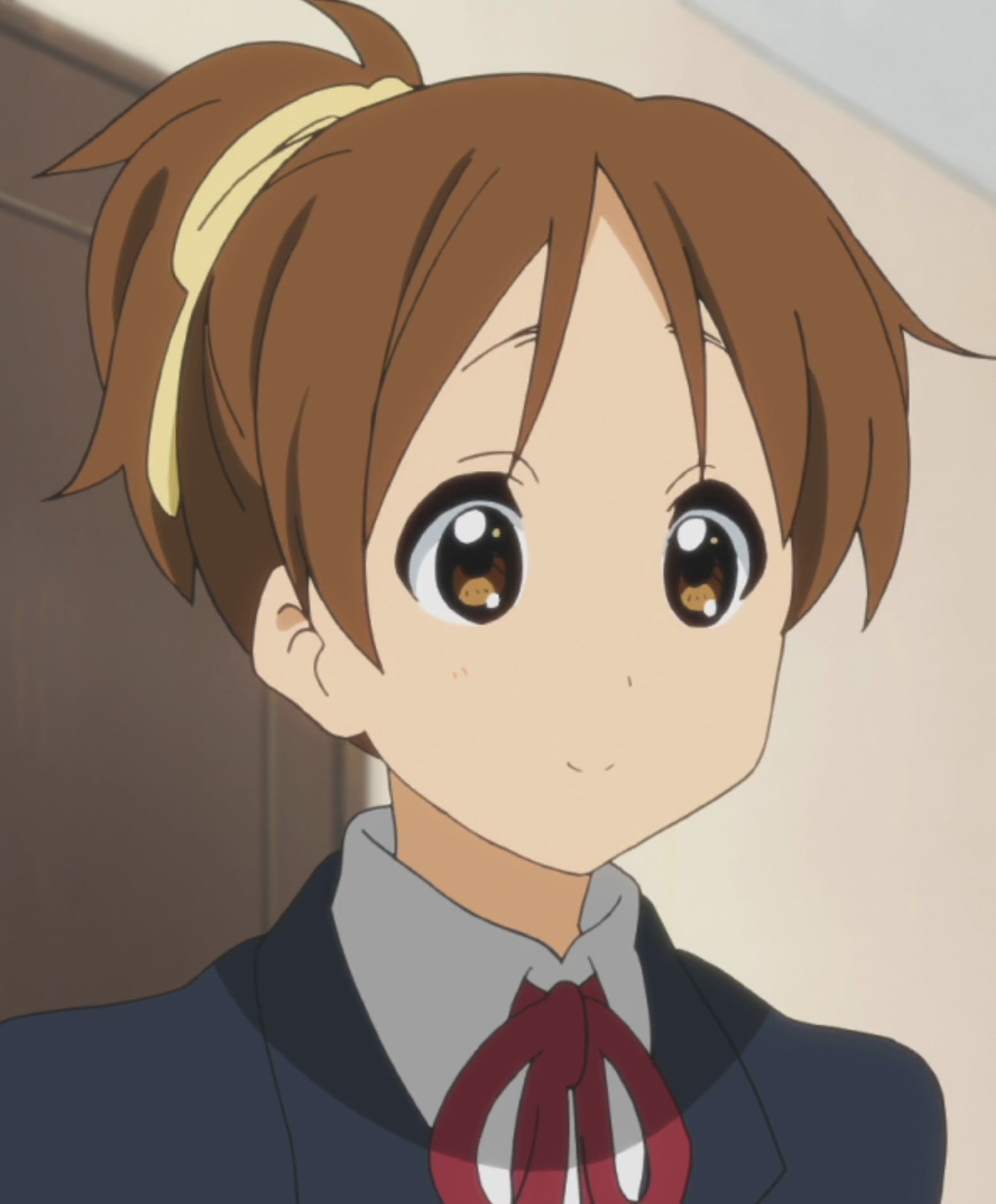 An anime-style character of a young, high school-aged girl with brown hair and a red bow, wearing a school uniform.