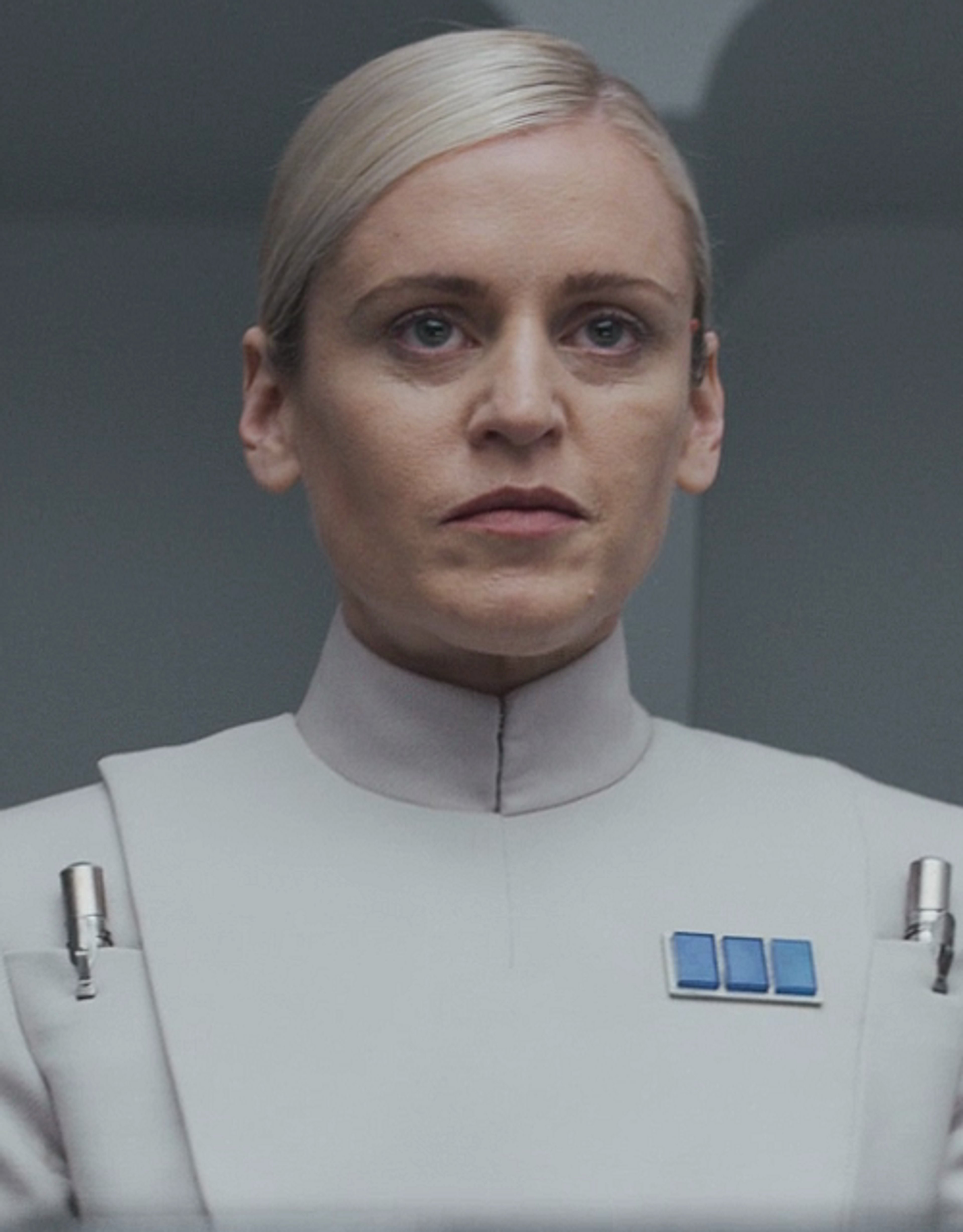 A woman in an Imperial uniform with a serious expression