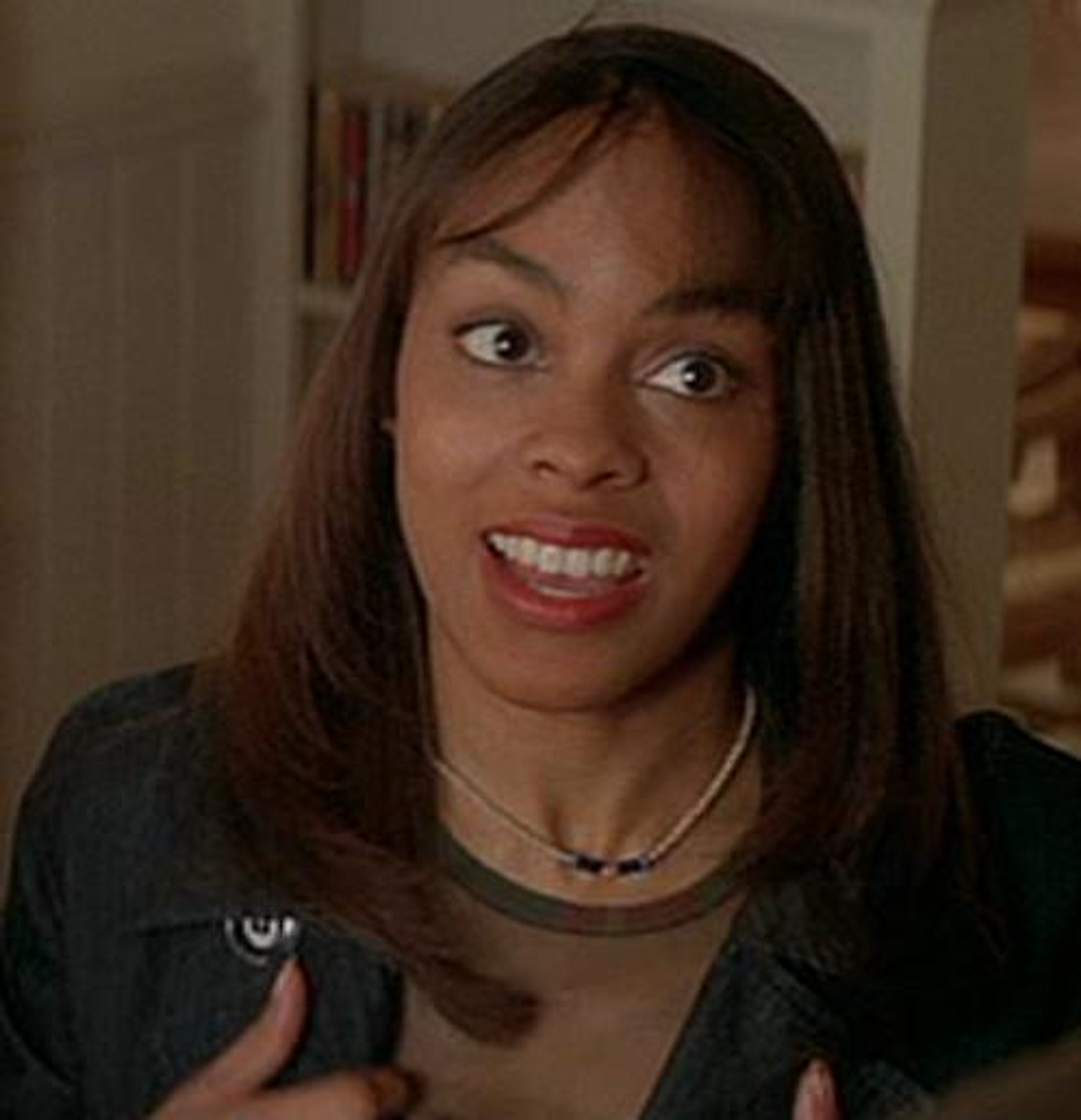 A young woman with a friendly expression