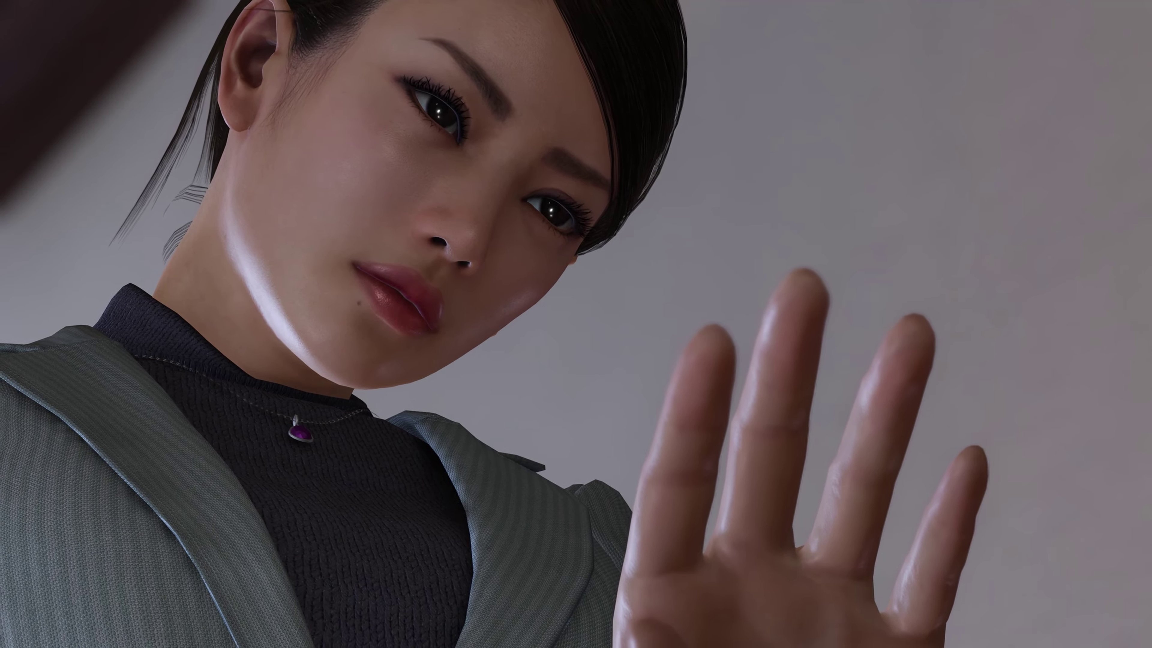 A young woman in a police uniform making a commanding gesture