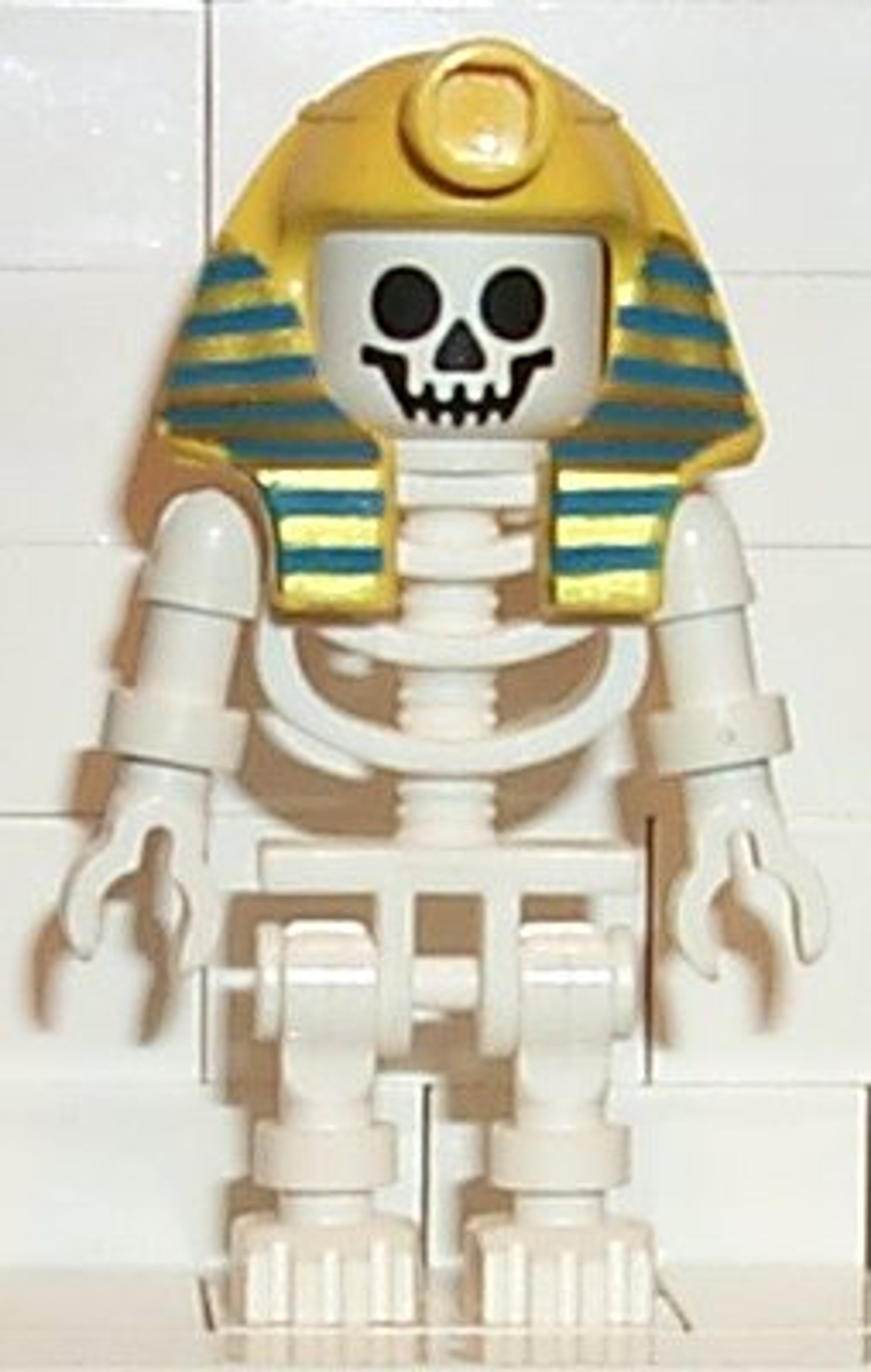 A LEGO figure of a skeletal pharaoh-like character
