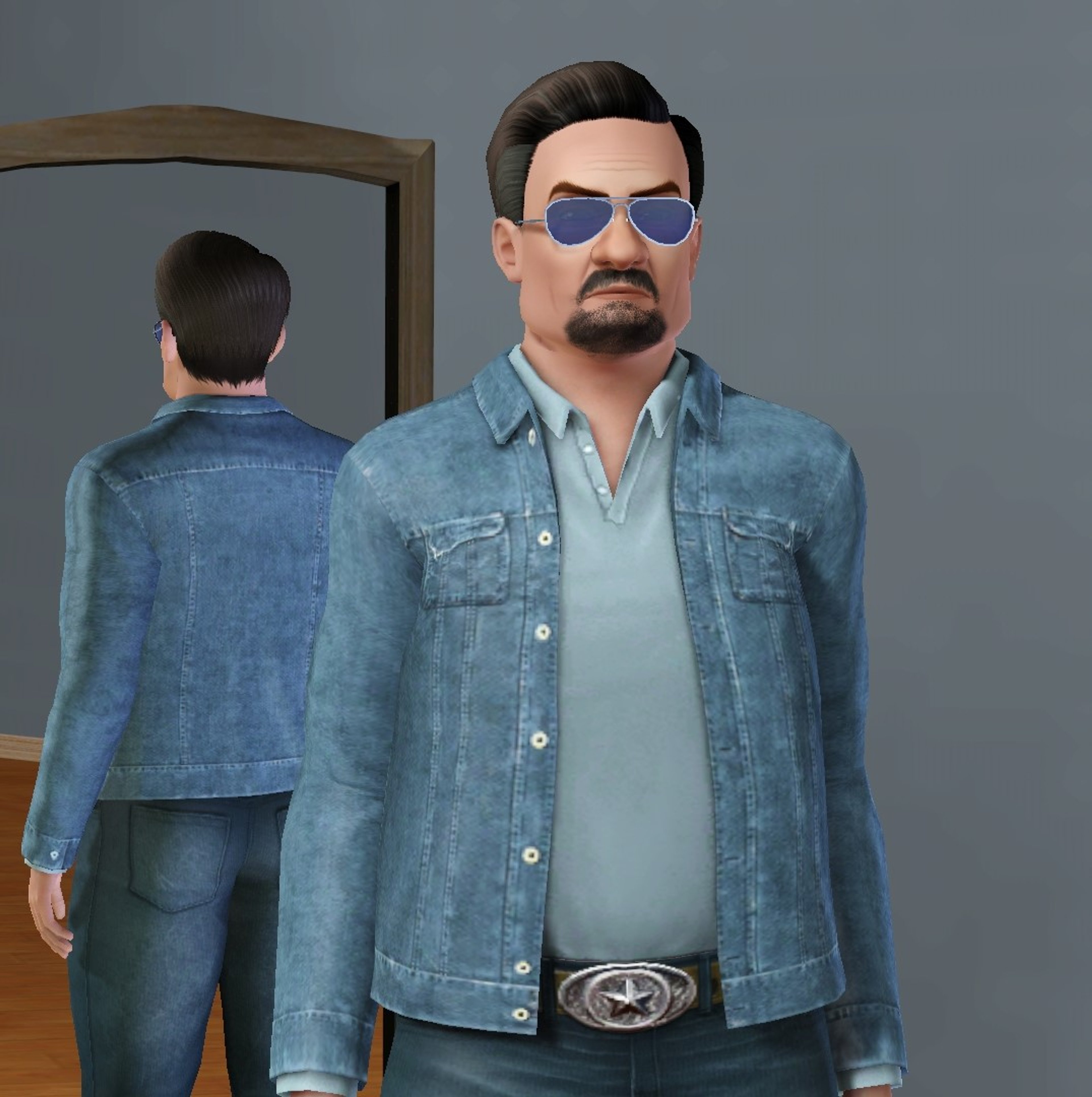 A middle-aged man with a beard and sunglasses, wearing a denim jacket