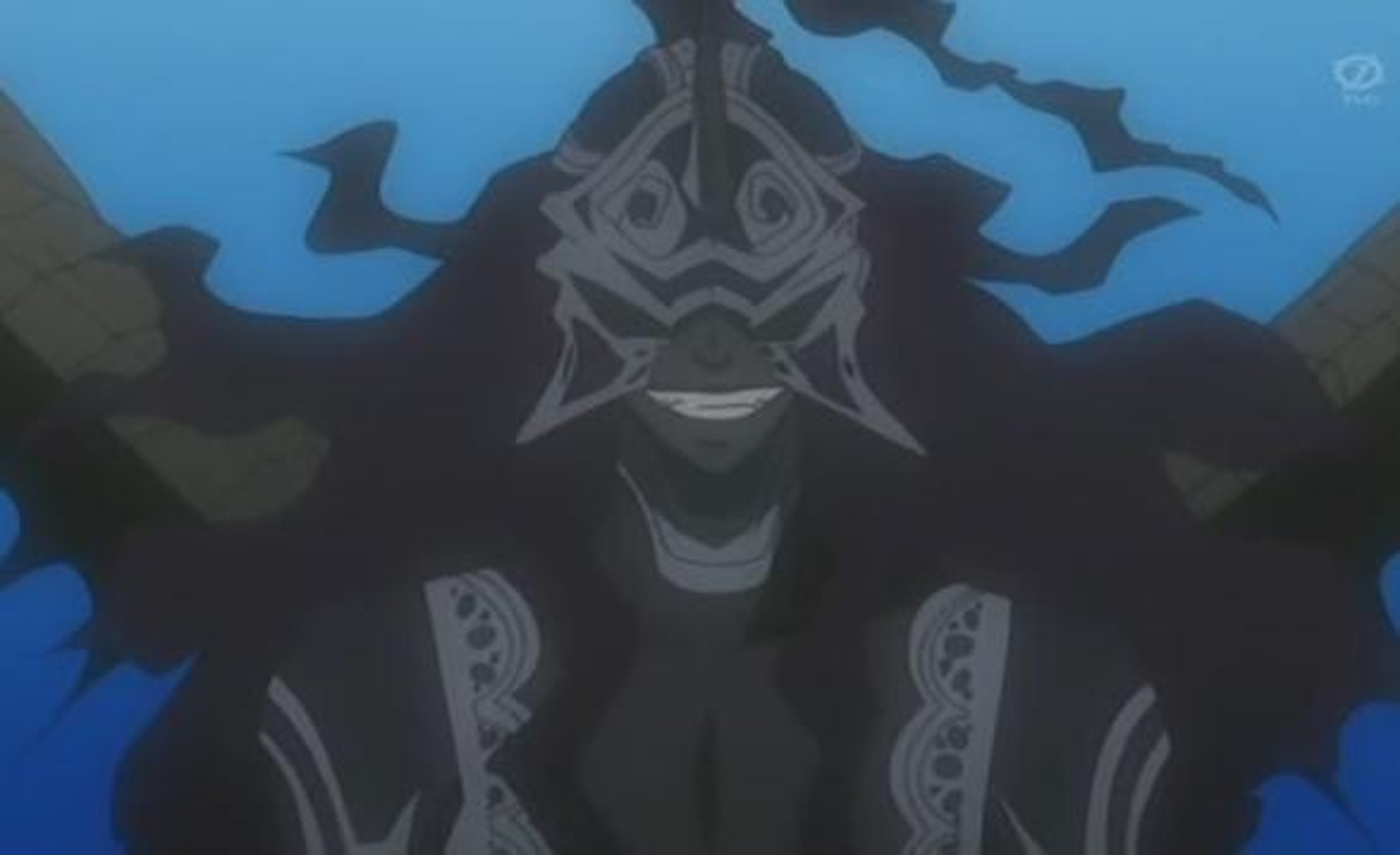 A man in a black suit with a serious expression