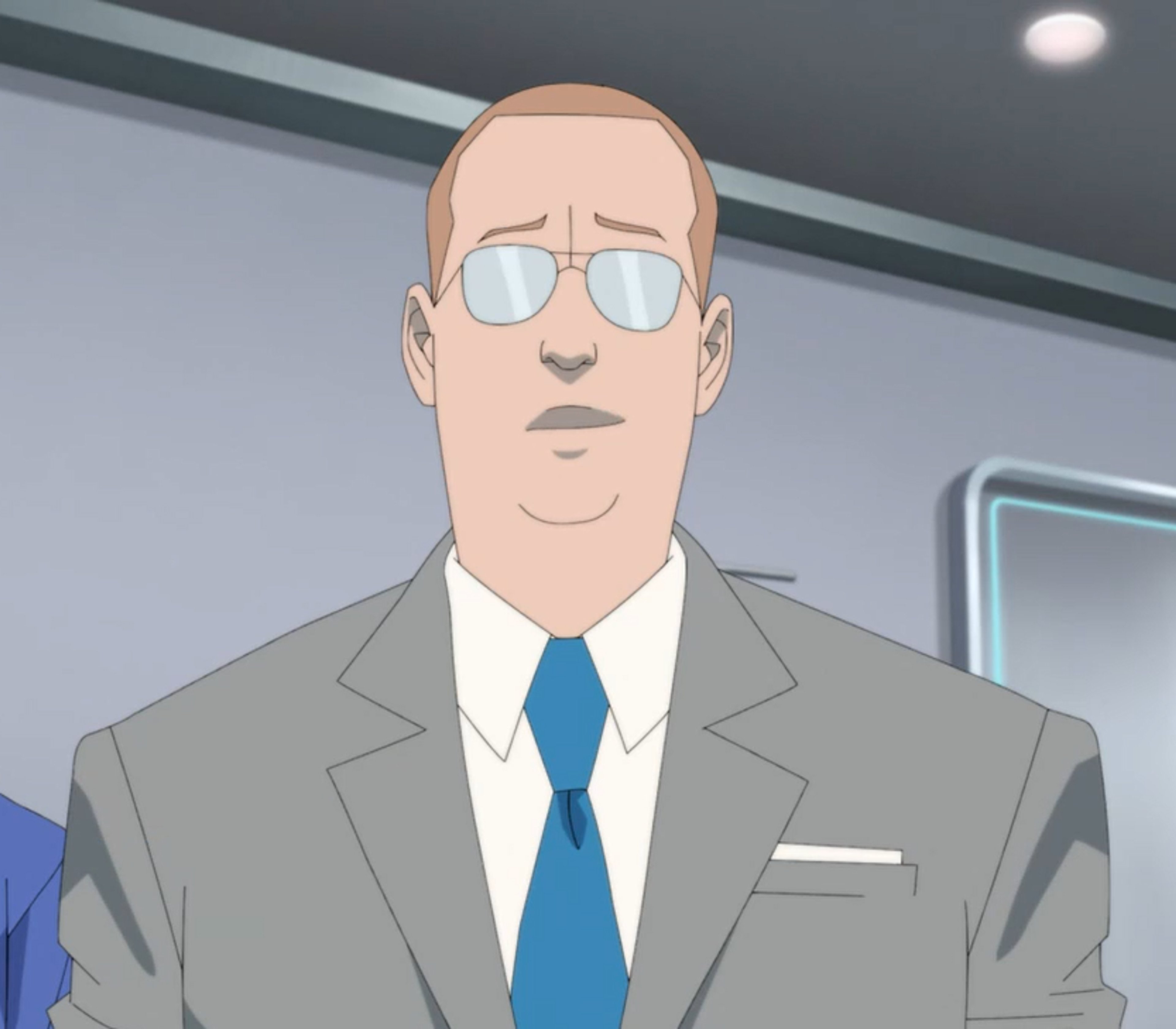 A professional-looking man in a suit and sunglasses