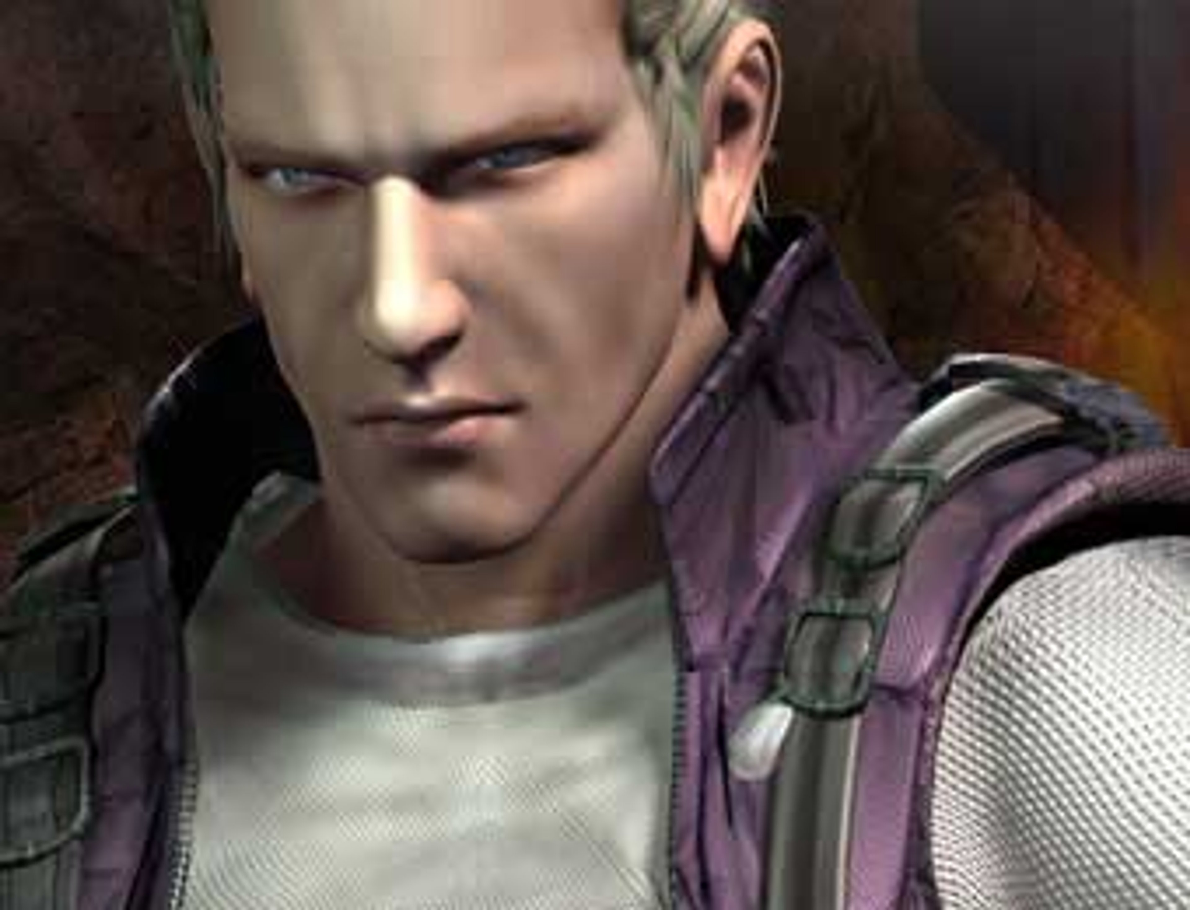 A man with short dark hair wearing a gray shirt and purple tactical gear, with a serious expression on his face.