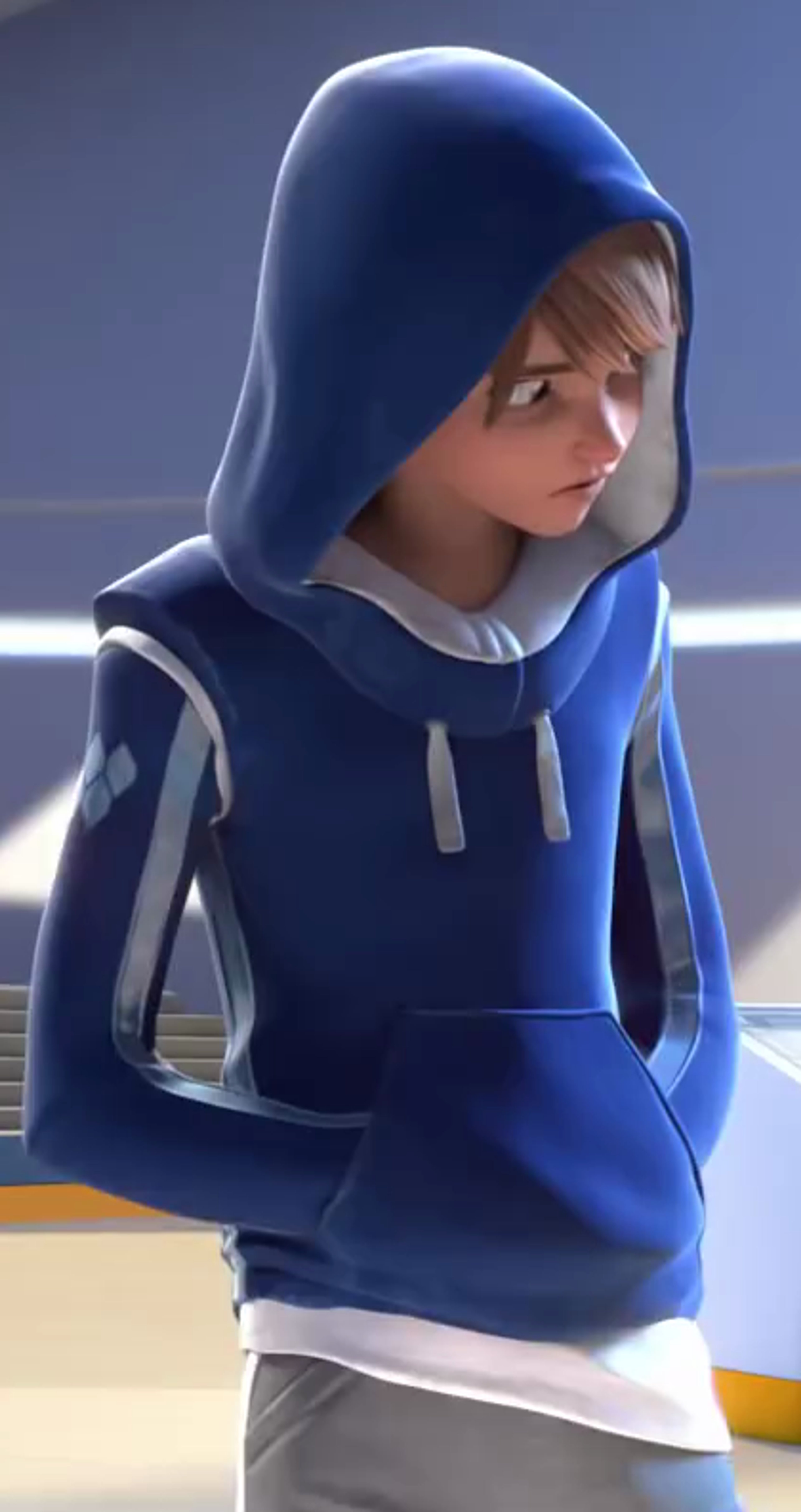 A young person in a blue hooded sweatshirt looking down