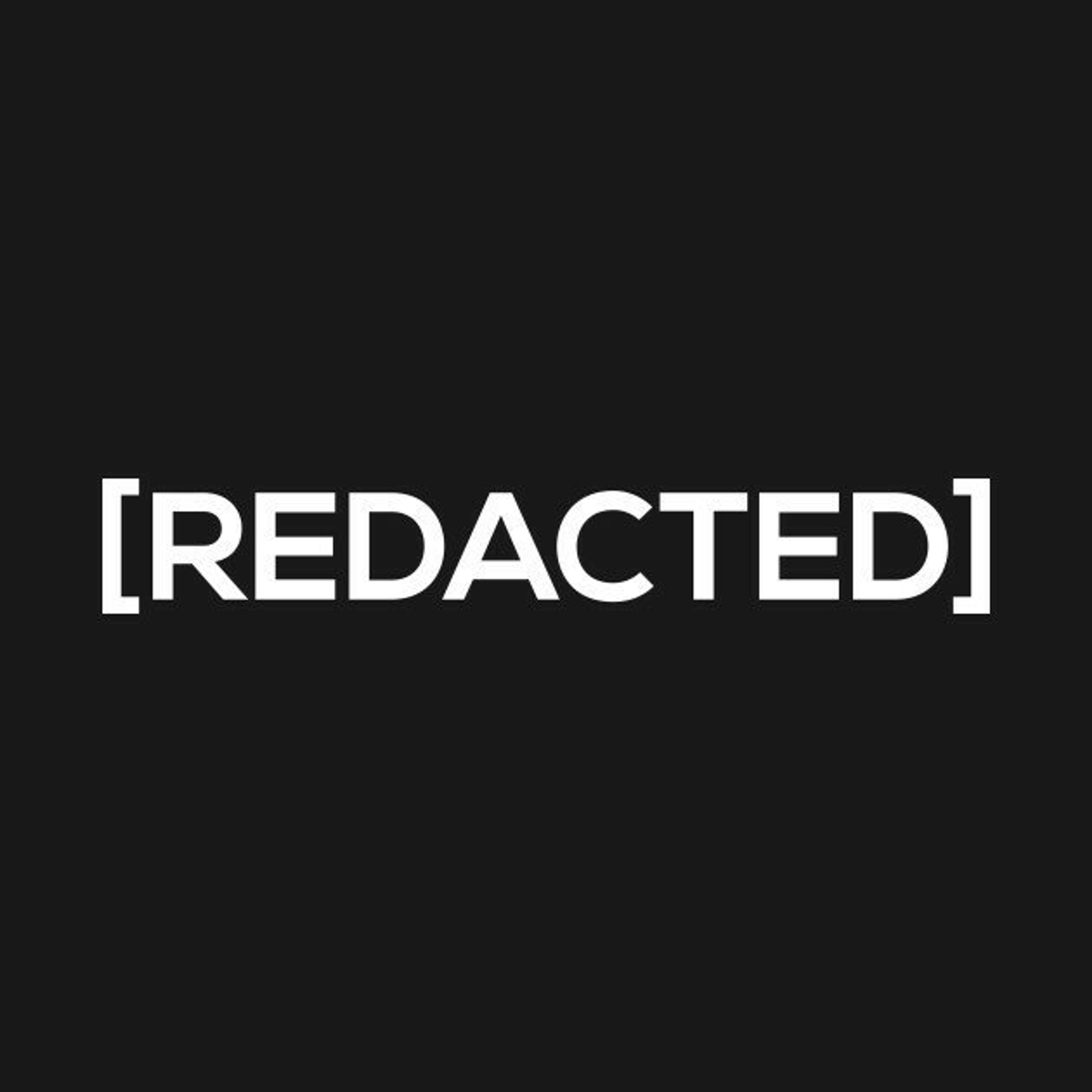 A black background with the word 'REDACTED' in large white text.