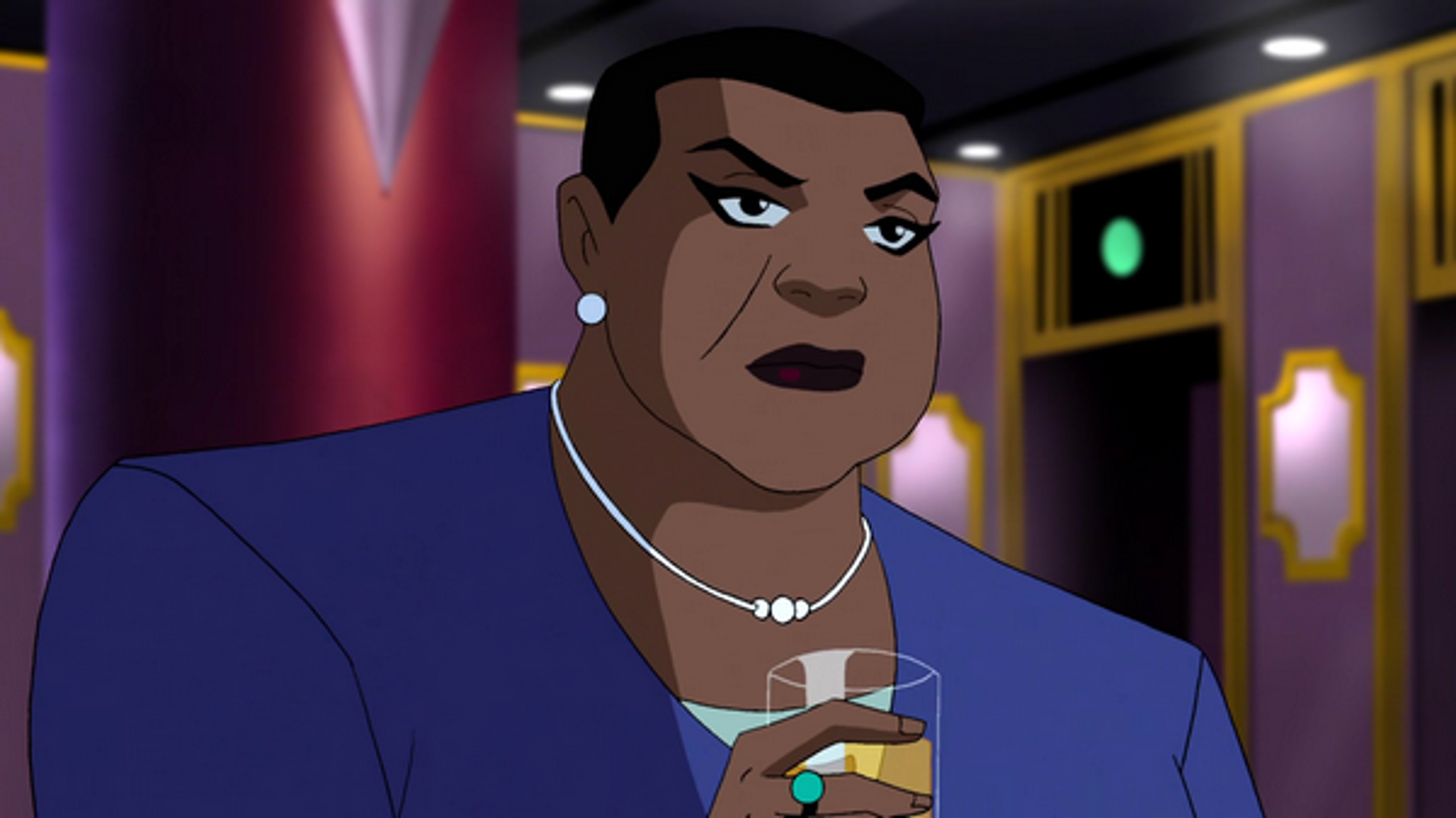 A serious-looking African American woman in a dark blue suit