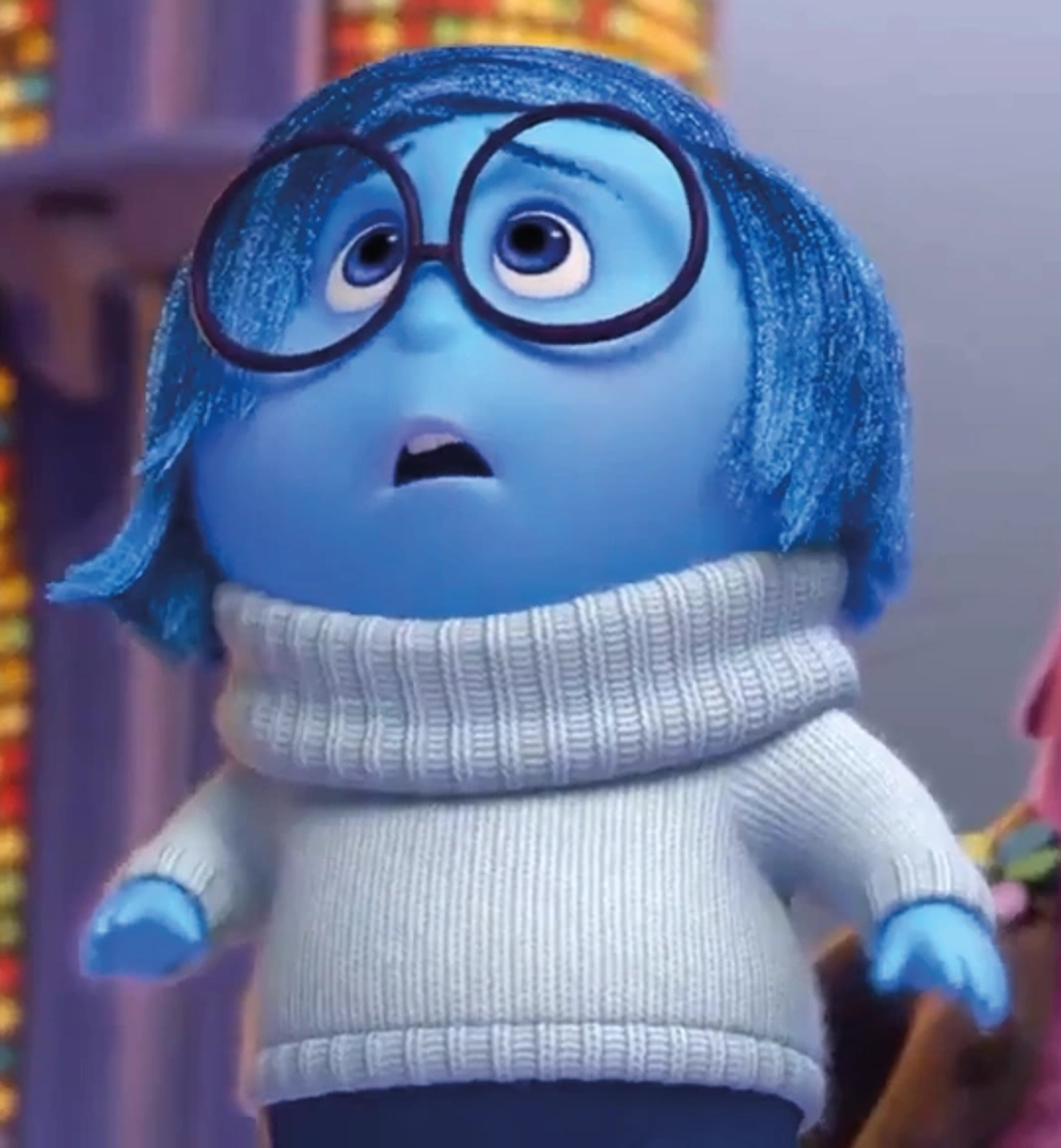A blue character with glasses and a white sweater from the Pixar film Inside Out