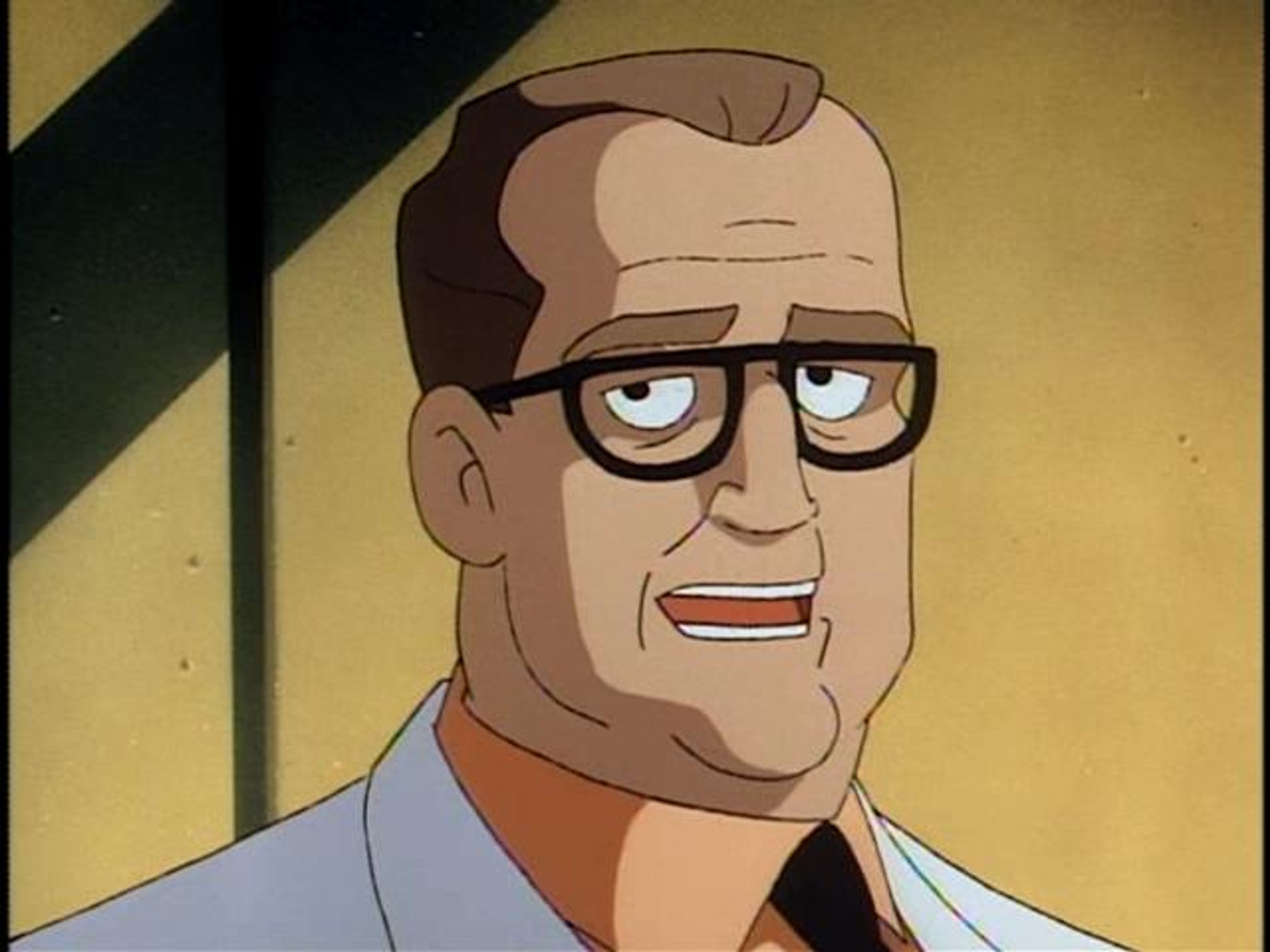 A middle-aged man with glasses and a serious expression, wearing a white shirt and dark jacket