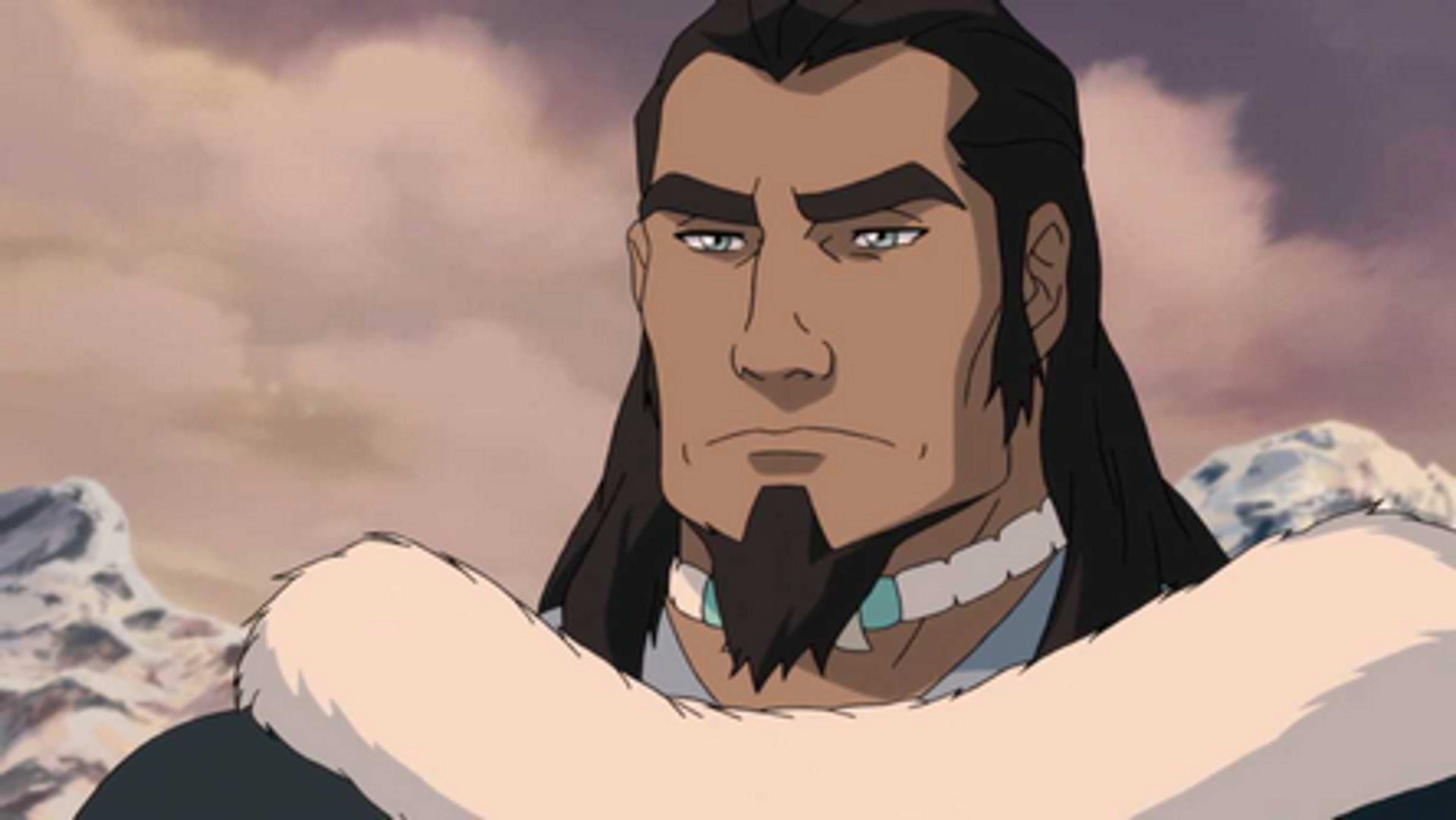 A middle-aged man with long dark hair and a beard, wearing a fur-lined coat and having a stern, determined expression.